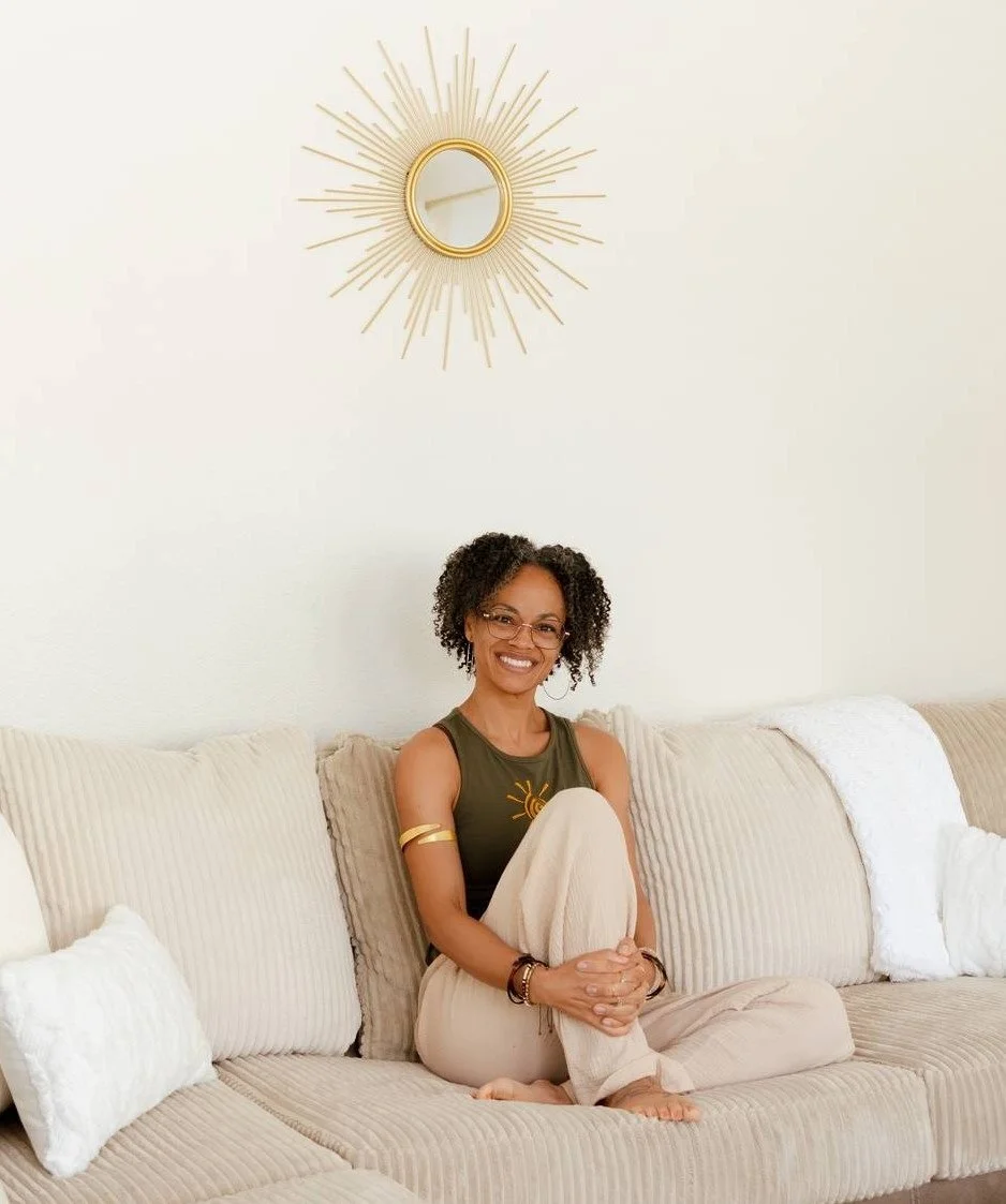 Nixa seated comfortably in a calming home environment for holistic wellness coaching