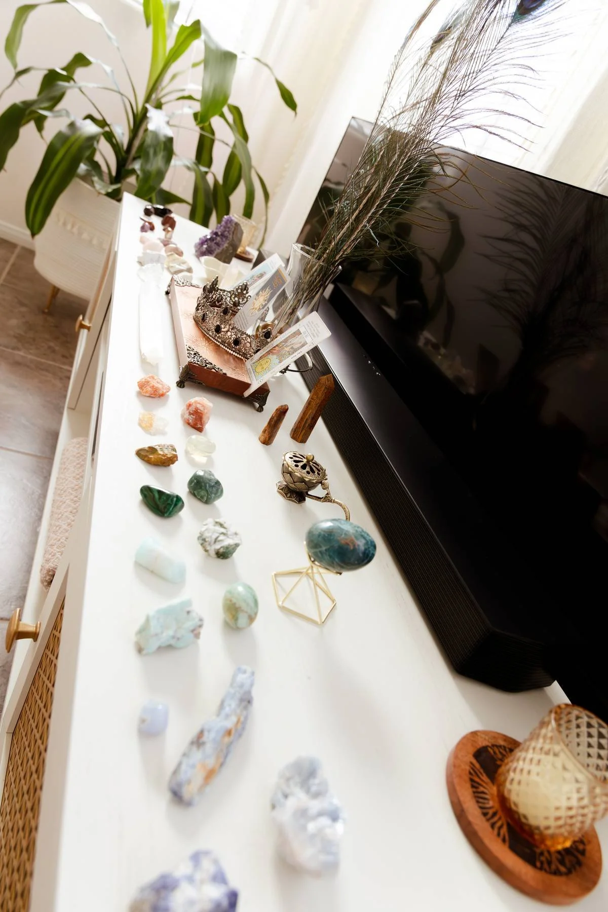 Crystals and wellness tools arranged in a calming mindfulness space