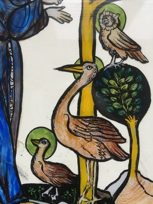 Detail of a reverse glass painting featuring a pelican, an owl, and a small bird, with the figure of St Francis of Assisi in blue in the act of communicating with the birds of earth and heaven. 