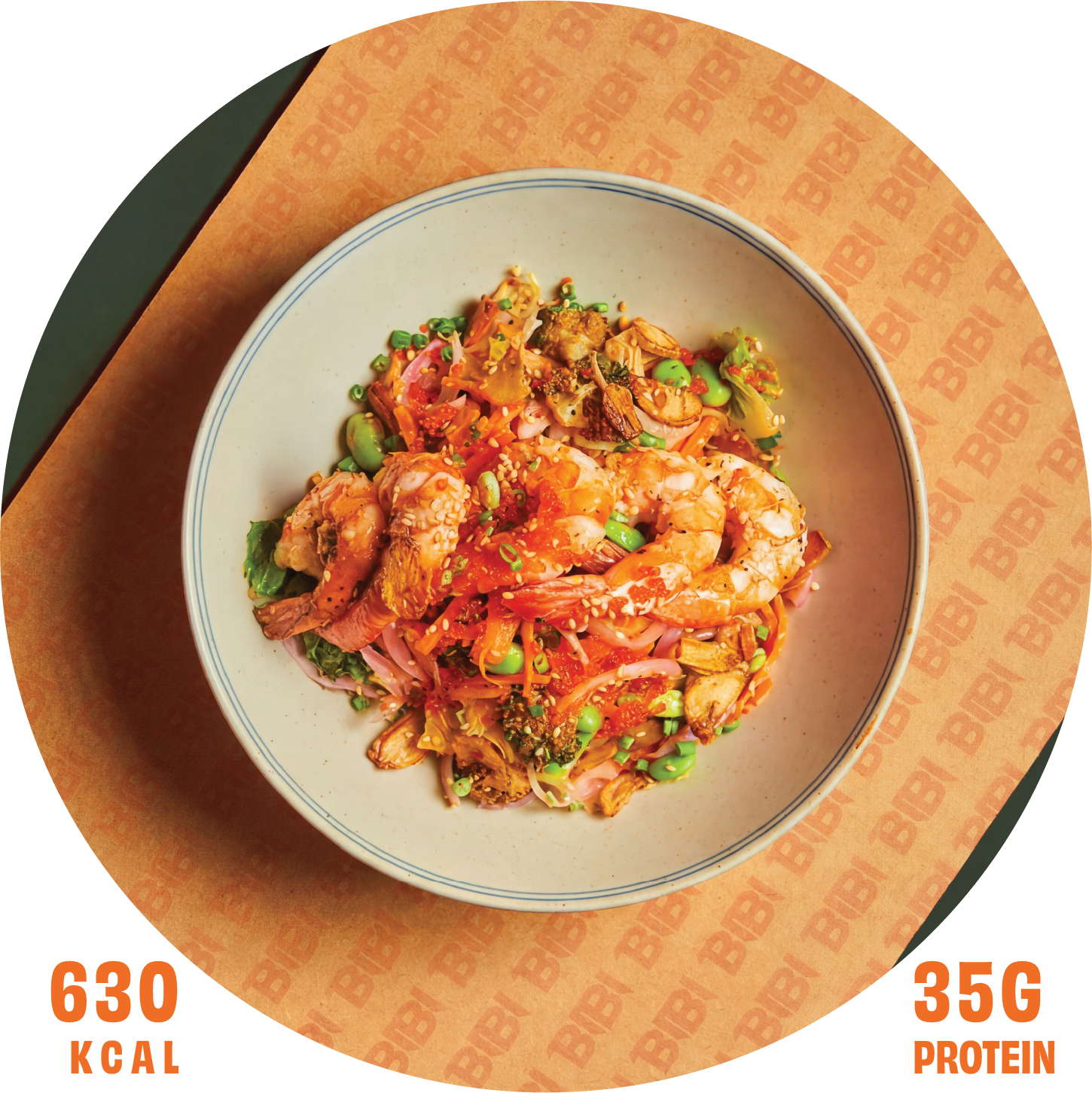 A bowl of Asian noodle salad with shrimp, vegetables, and sesame seeds, served on a paper doily with a Bibi logo pattern.