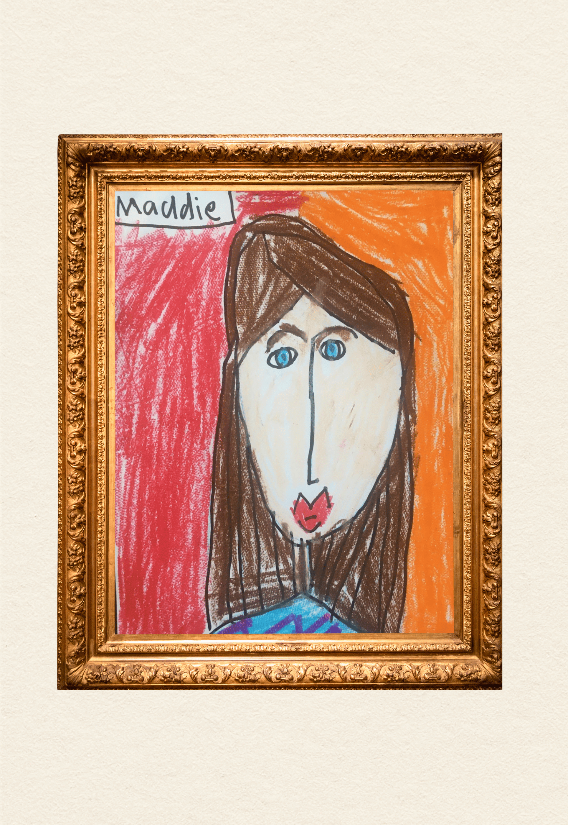 Child's drawing of a person with brown hair, big blue eyes, and red lips, with a red and orange background, framed in an ornate gold frame, labeled 'Maddie'.