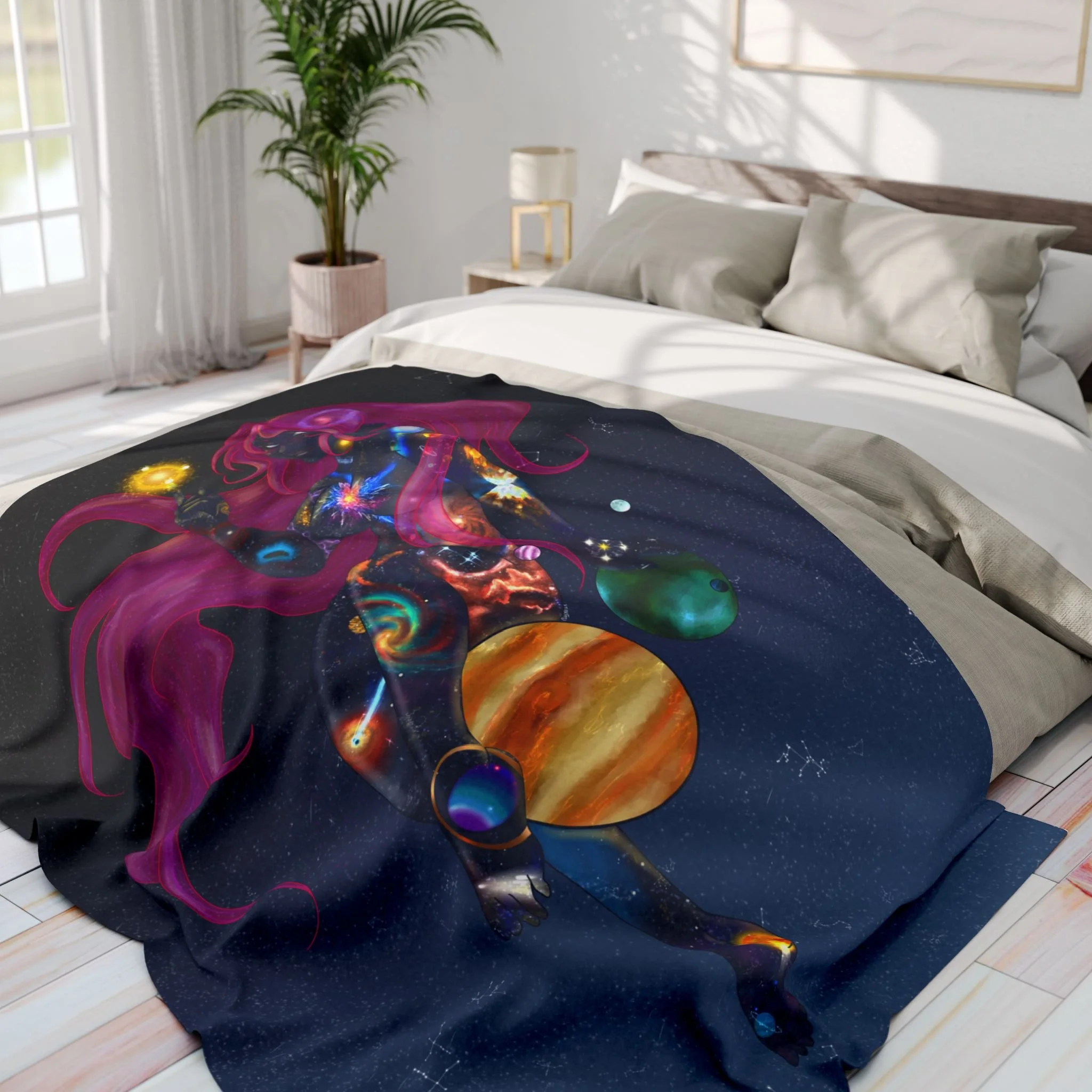 A bed with white bedding and beige pillows, a potted plant in a pink pot, a white lamp with a gold stand on a white nightstand, and a framed picture on the wall, sunlight streaming through a window, and a colorful galaxy-themed blanket on the bed.