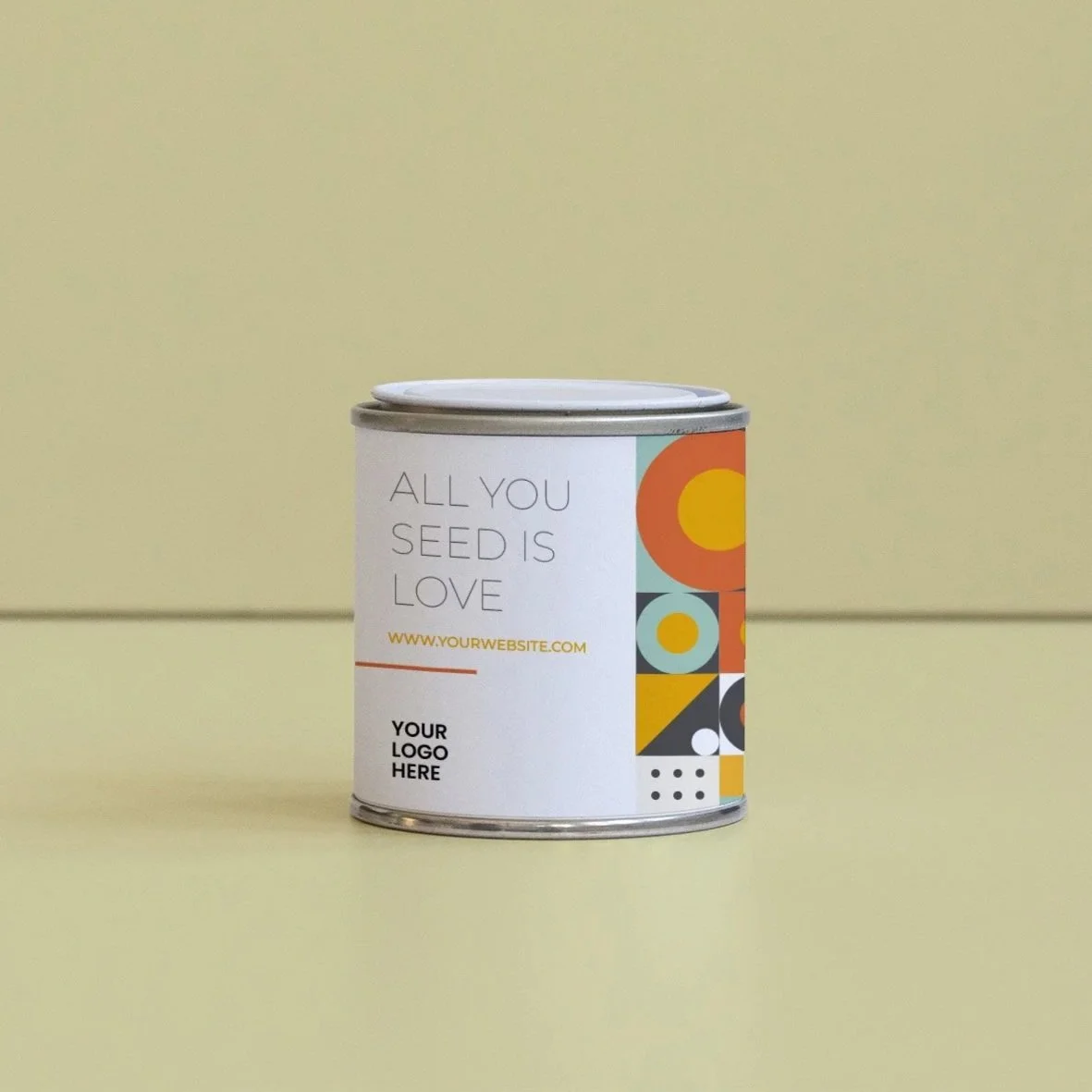 Lata en fondo de color amarillo con etiqueta que dice 'All you seed is love', con espacio para logo y diseño de formas geométricas de colores