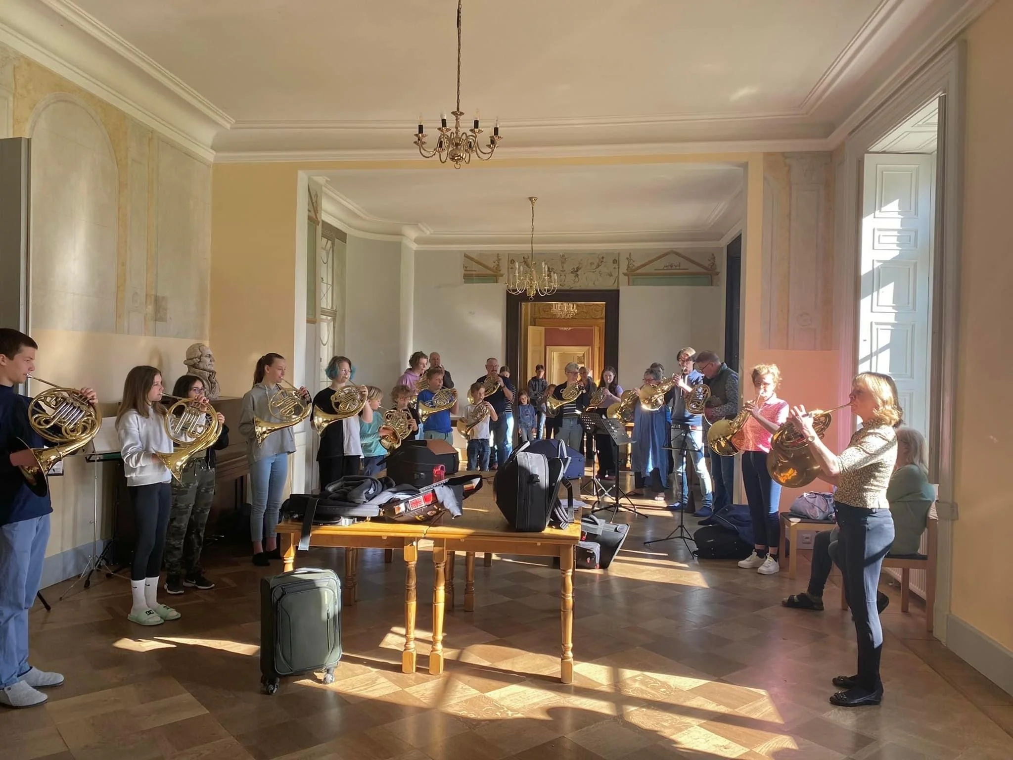 Kristina Mascher-Turner leading a group warmup at Schloss Dreilützow Horn Festival with the American Horn Quartet, April 2023