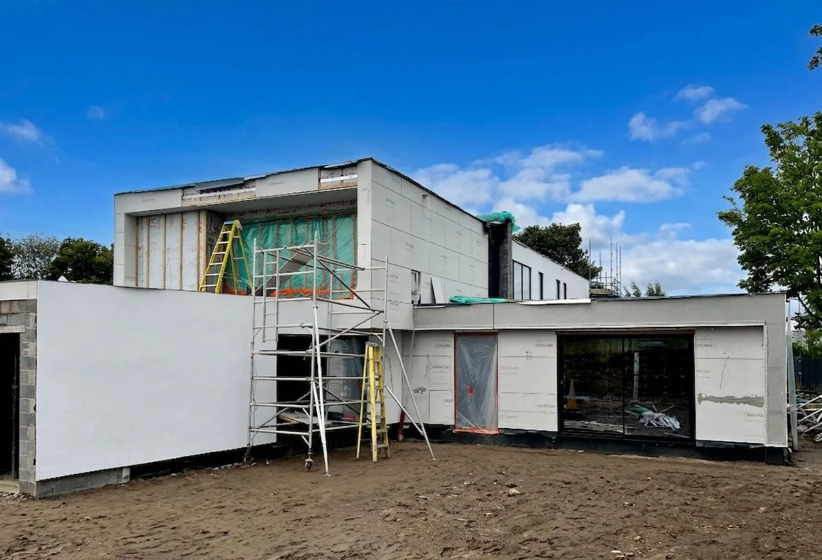 New-build family home exterior, Edinburgh — stone, render and zinc cladding