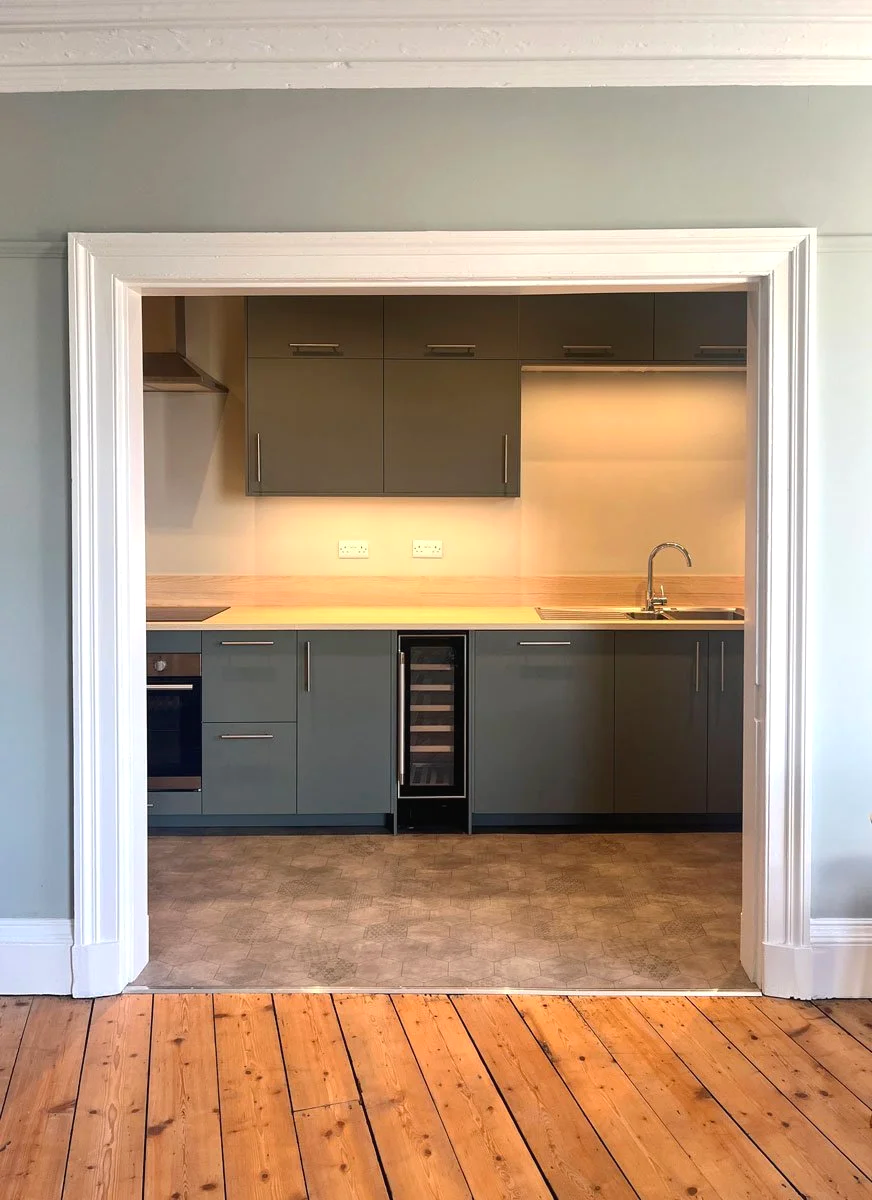 Historic flat conversion, central Edinburgh — original character reinstated with new open kitchen