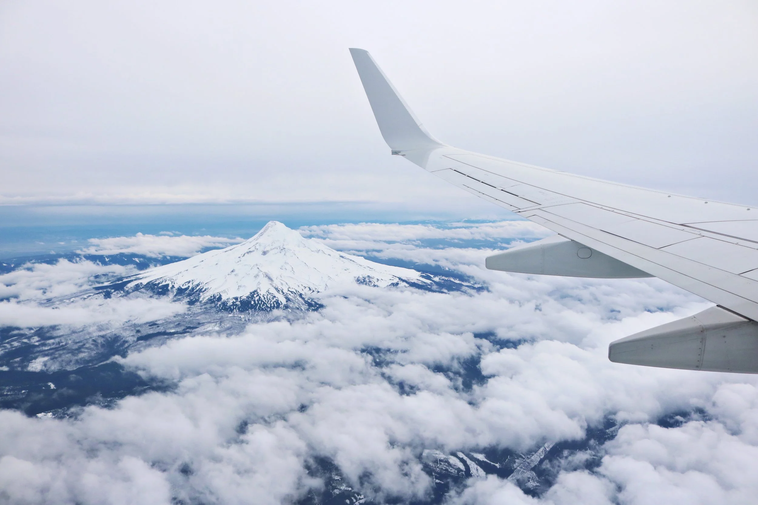 Aeroplane above clouds — flights to Japan from Australia cost and budget guide