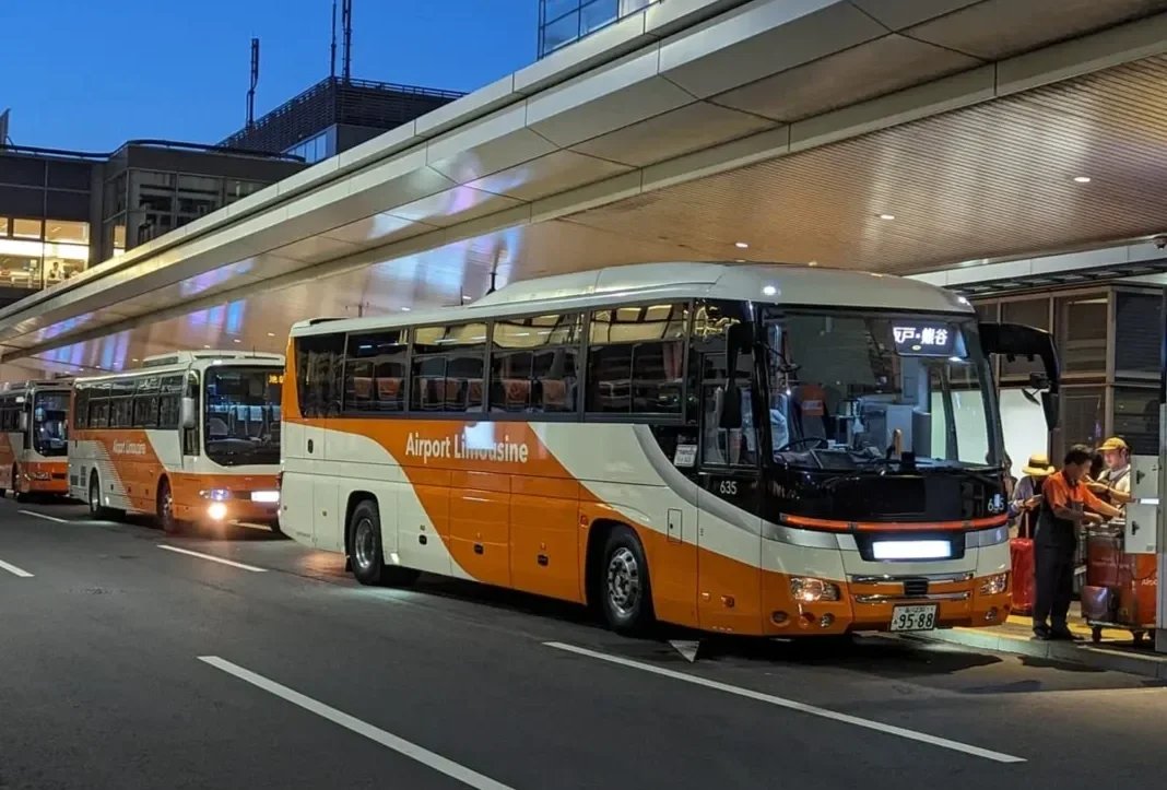 Airport limousine bus loading luggage at a Japan airport terminal