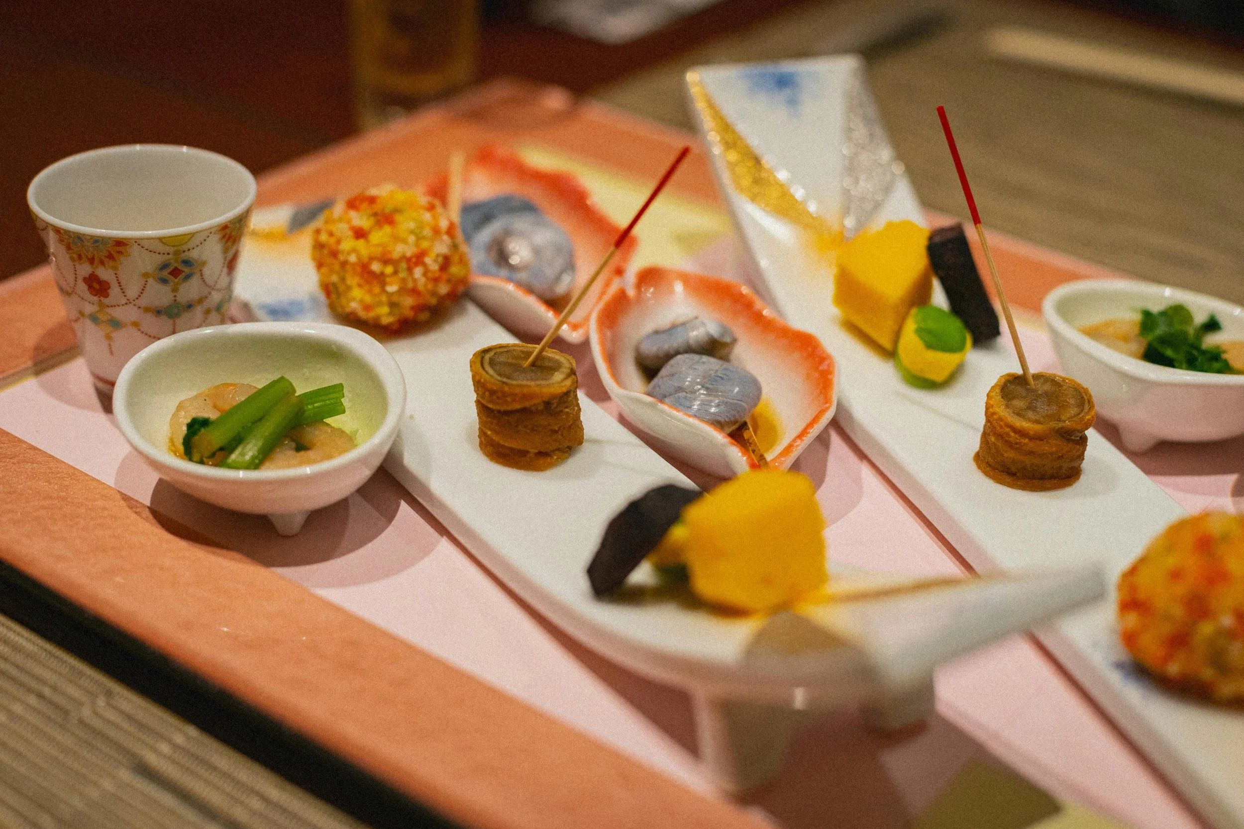 Traditional Japanese kaiseki dinner spread — ryokan accommodation costs in Japan