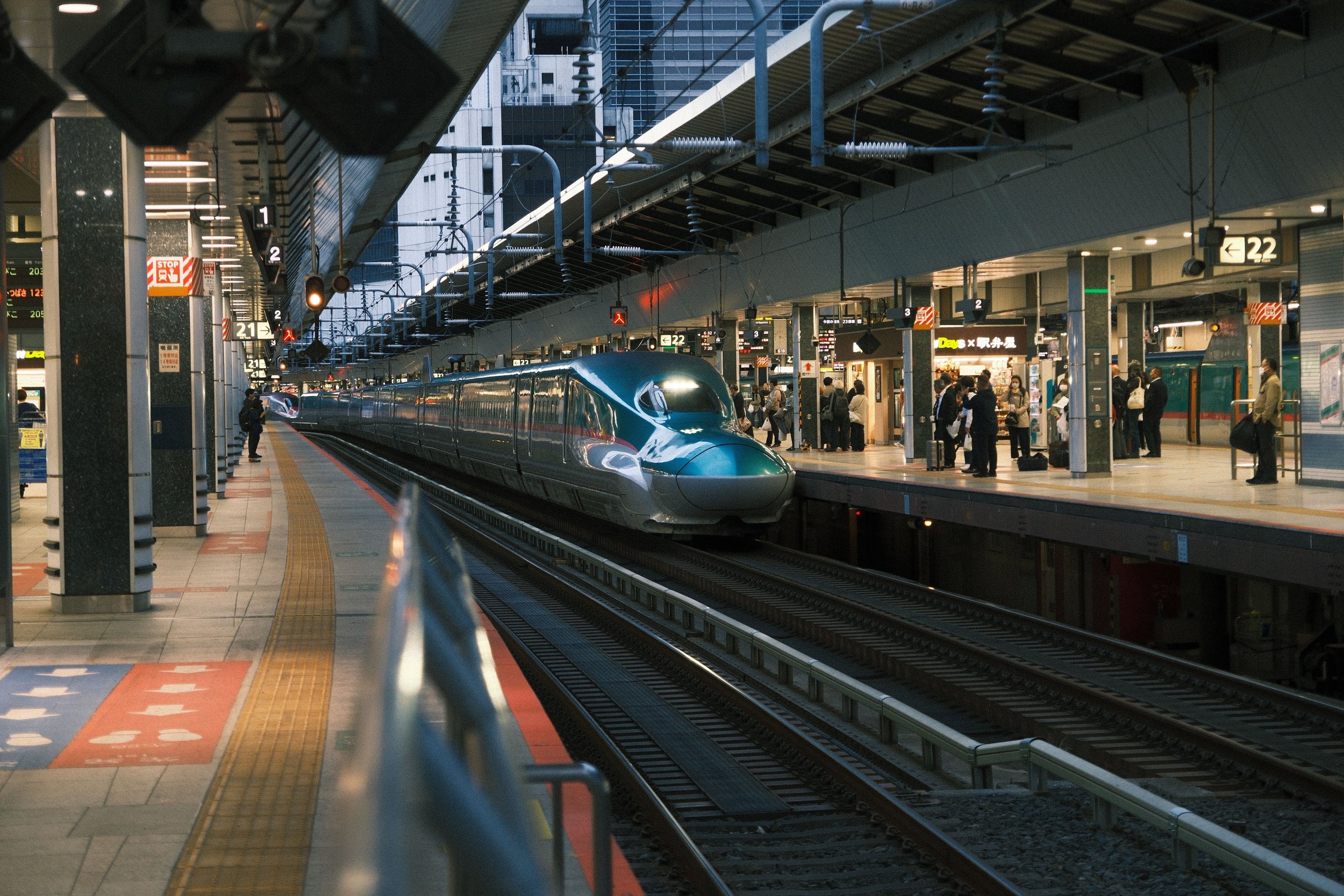 Shinkansen arriving at a Japan train station platform