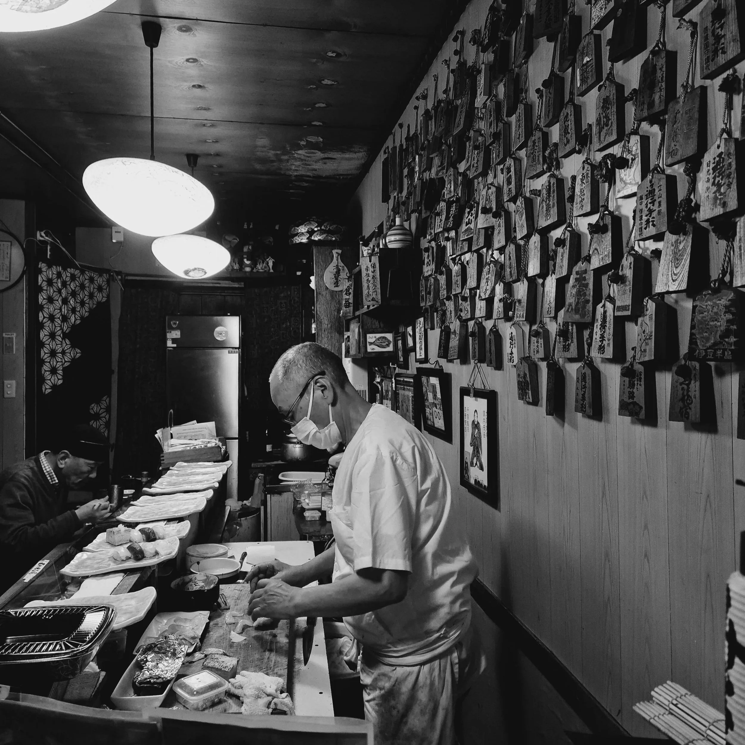 Japanese chef at work in local restaurant Japan — slow travel experiences are often the most memorable