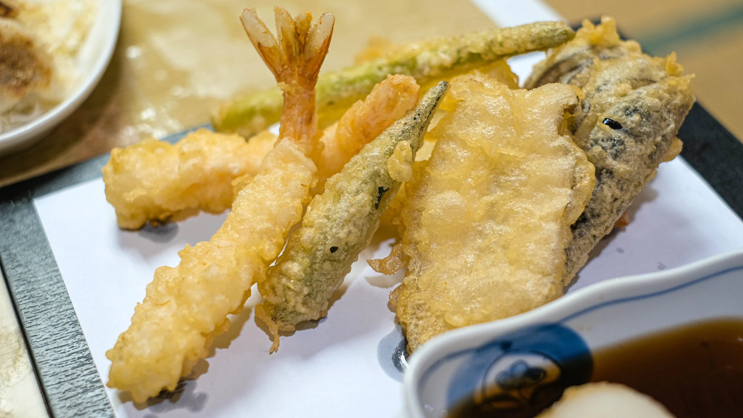 Tempura seafood and vegetables fried in light batter at a Tokyo tempura counter