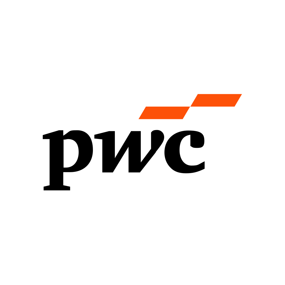 A white athletic shoe with black and orange accents on a running track, with a person’s leg in athletic gear in the background.