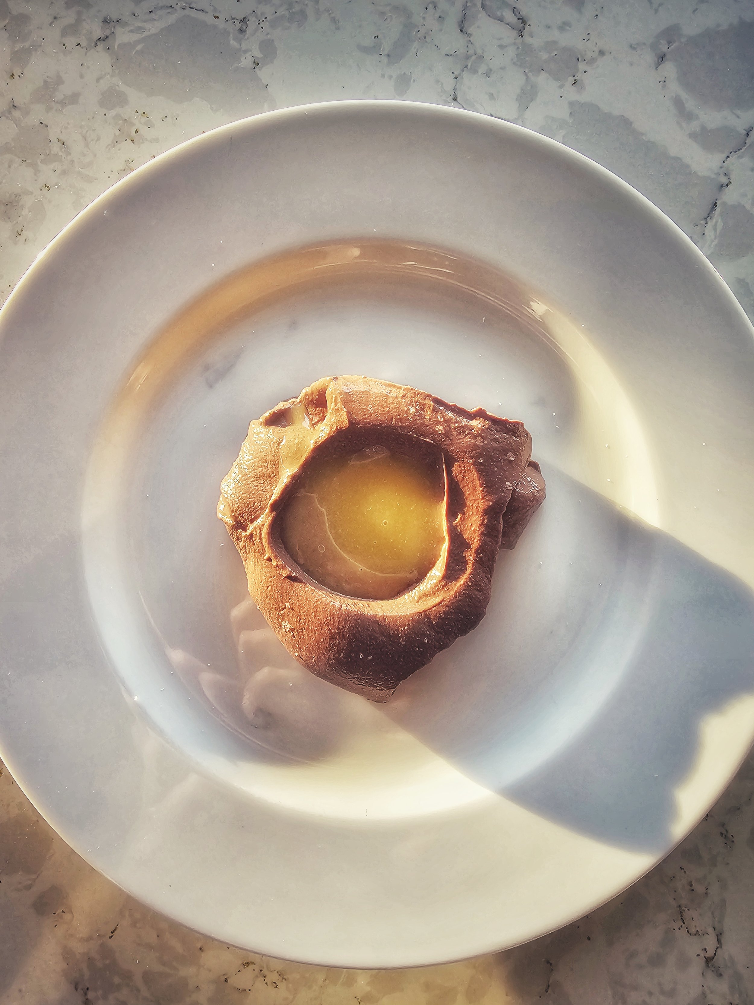 Silken tofu chocolate mousse, tahini caramel and passion fruit curd