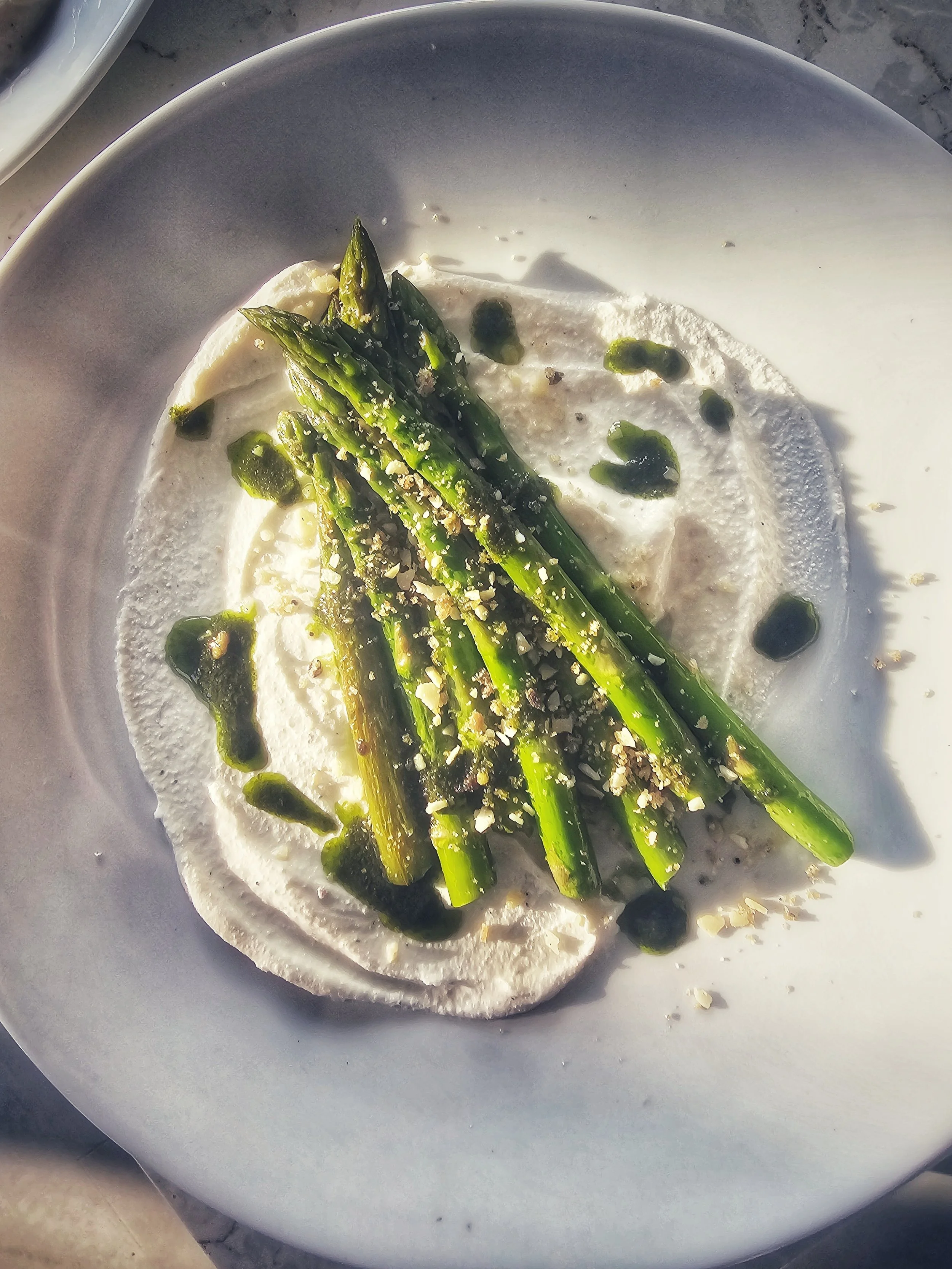 Grilled asparagus, whipped ricotta, basil oil and almon pangretta