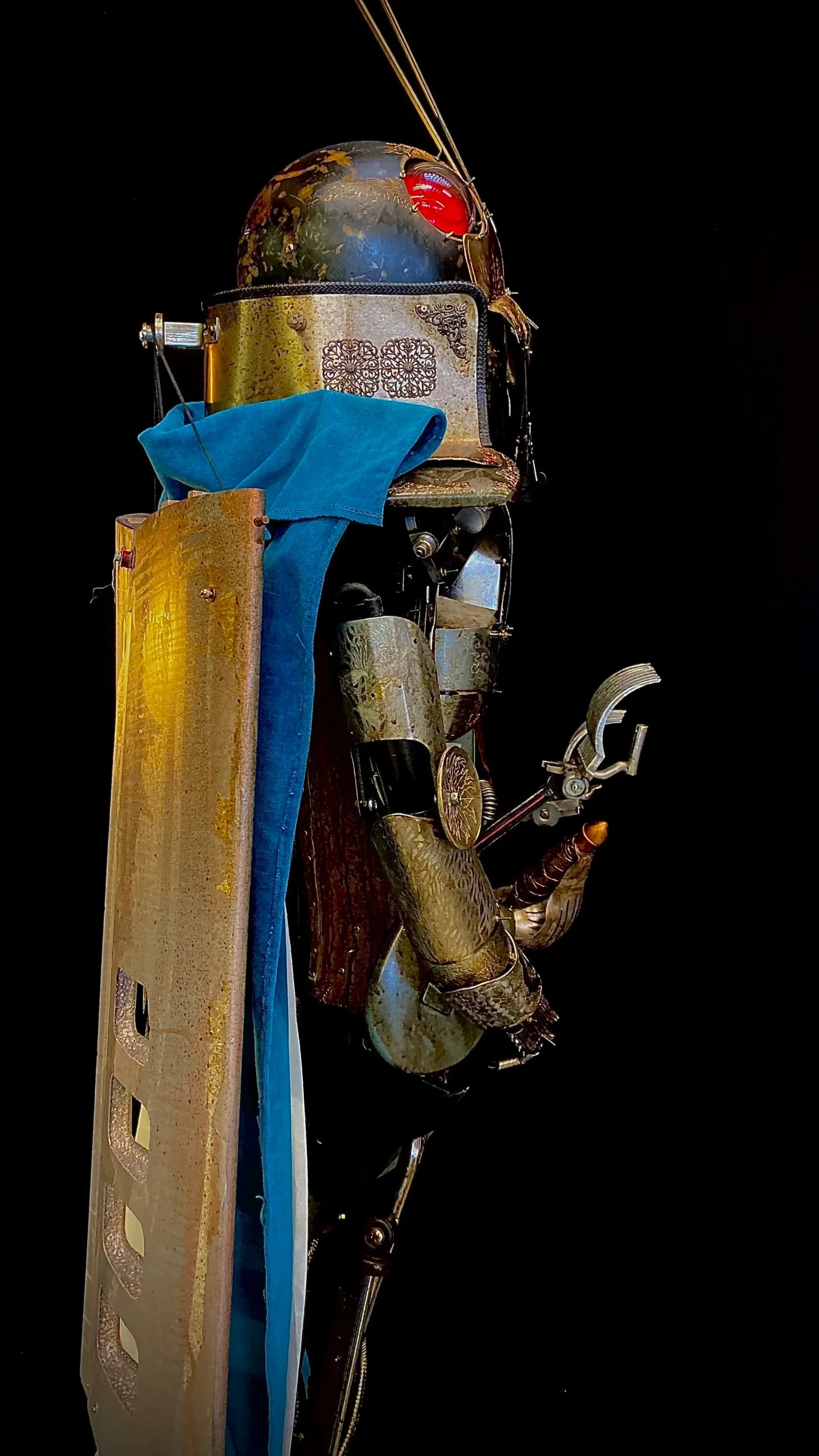 A humanoid robot with a vintage, steampunk style, featuring a globe-shaped head, metallic body parts, wires, and gears, against a black background.