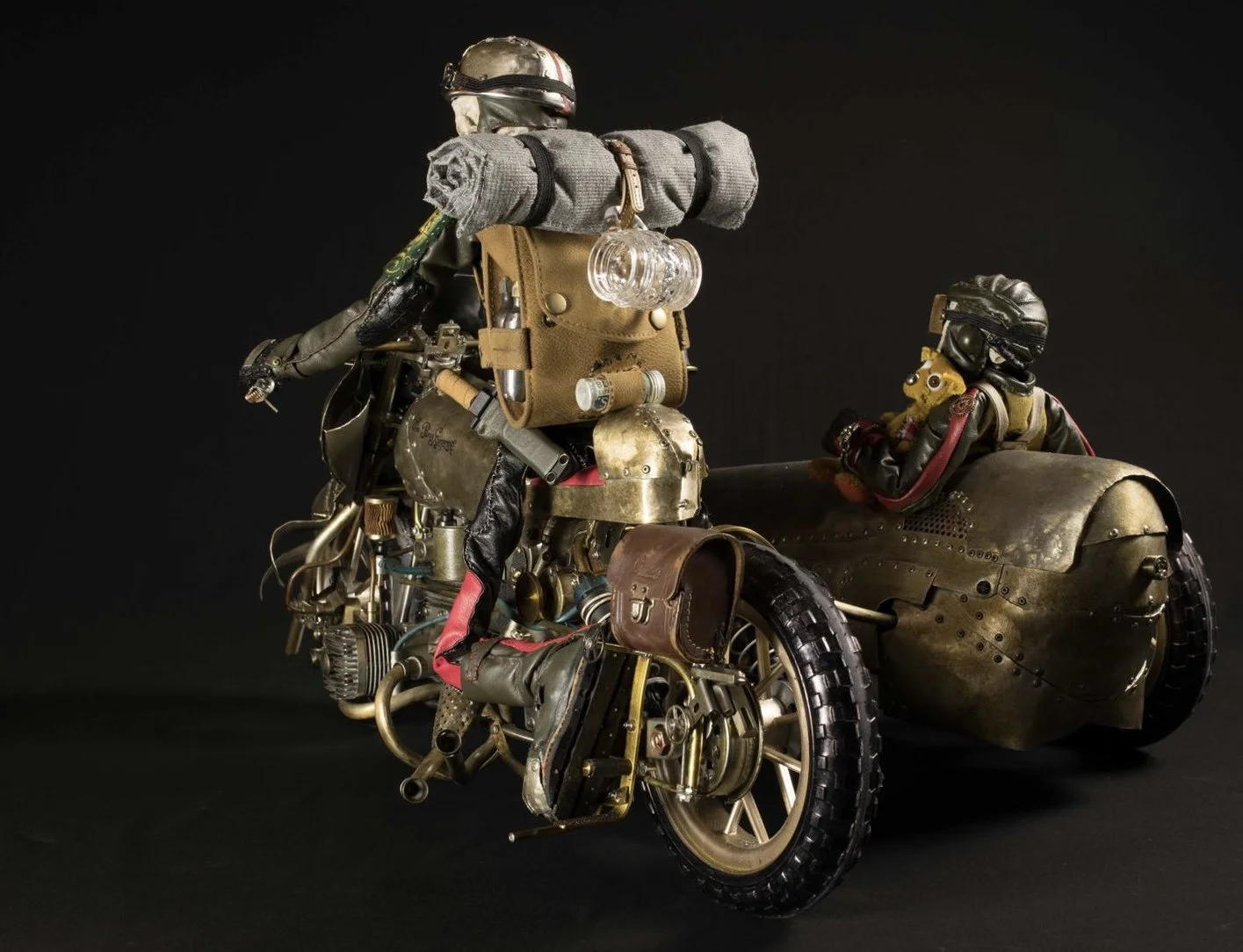 A steampunk-style motorcycle with a sidecar, equipped with vintage and mechanical details, against a black background.