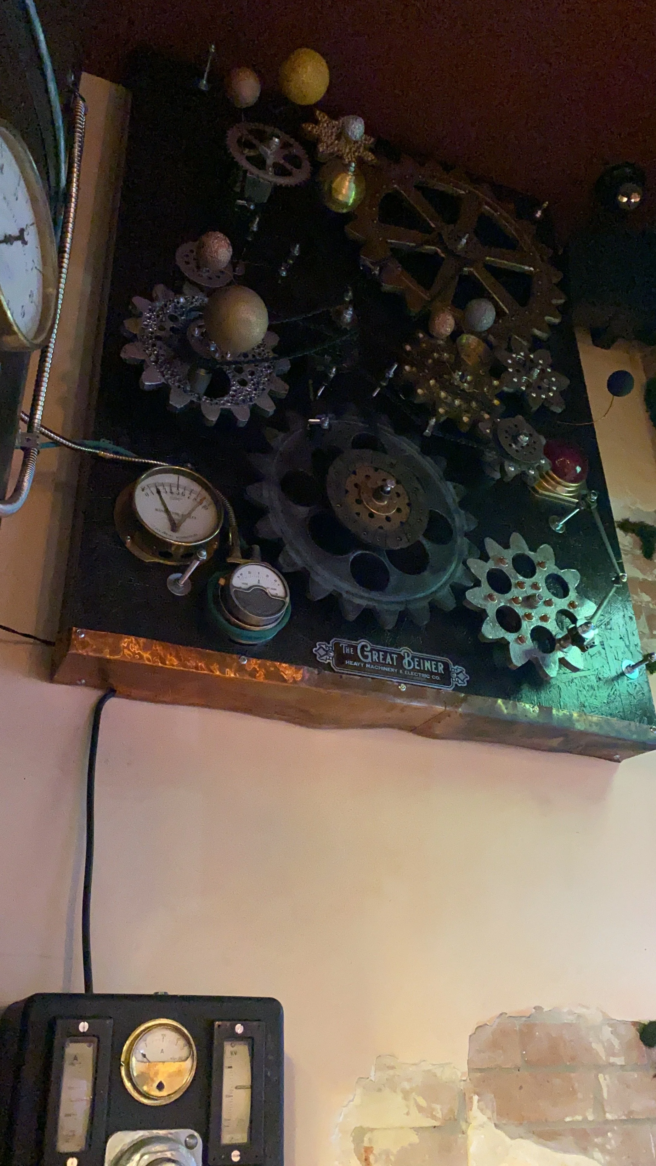 Steampunk-style wall clock with gears, cogs, and dials, labeled 'The Great Deiner Heavy Machinery & Electric Co.'