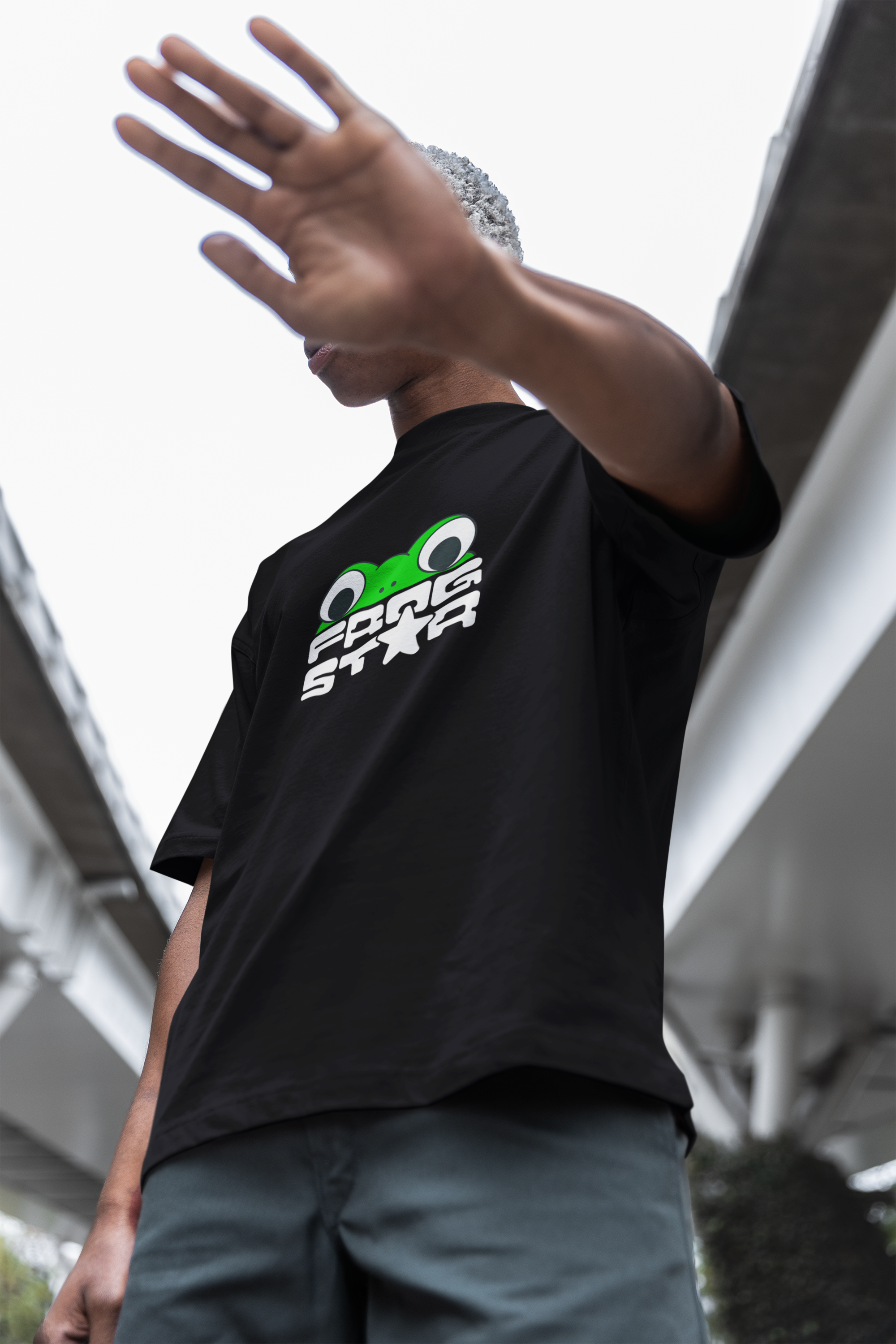 oversized-t-shirt-mockup-of-a-man-posing-in-the-street-while-covering-his-face-m38286 (1).png