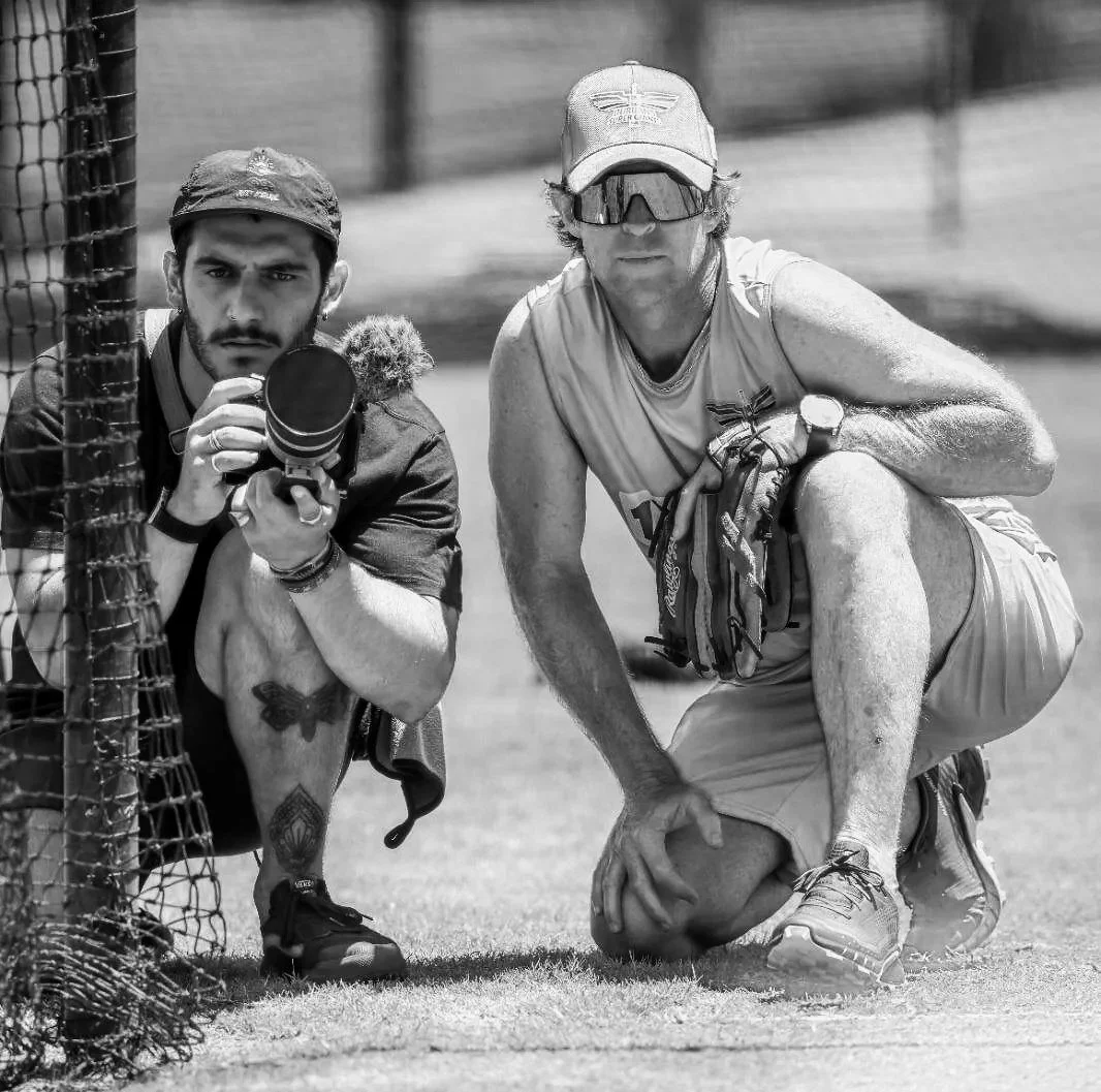 Riccardo Annandale of Drifter Media on location shooting video alongside former South African cricket legend Jonty Rhodes during an outdoor production session.