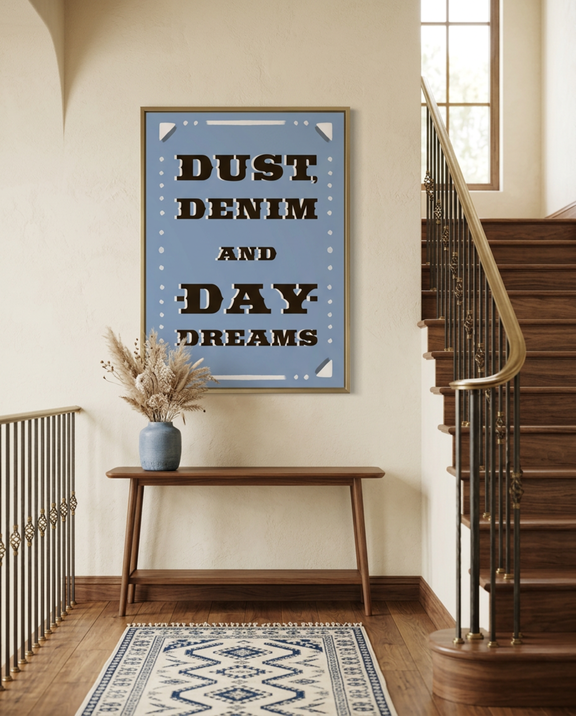 Dust, Denim and Daydreams western typography print framed above a hallway console by a wooden staircase