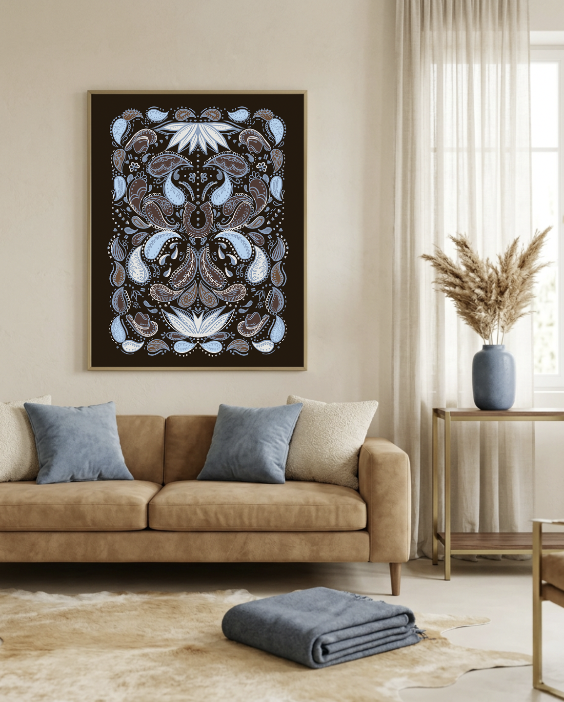 Blue and brown paisley bandana pattern print framed above a tan leather sofa