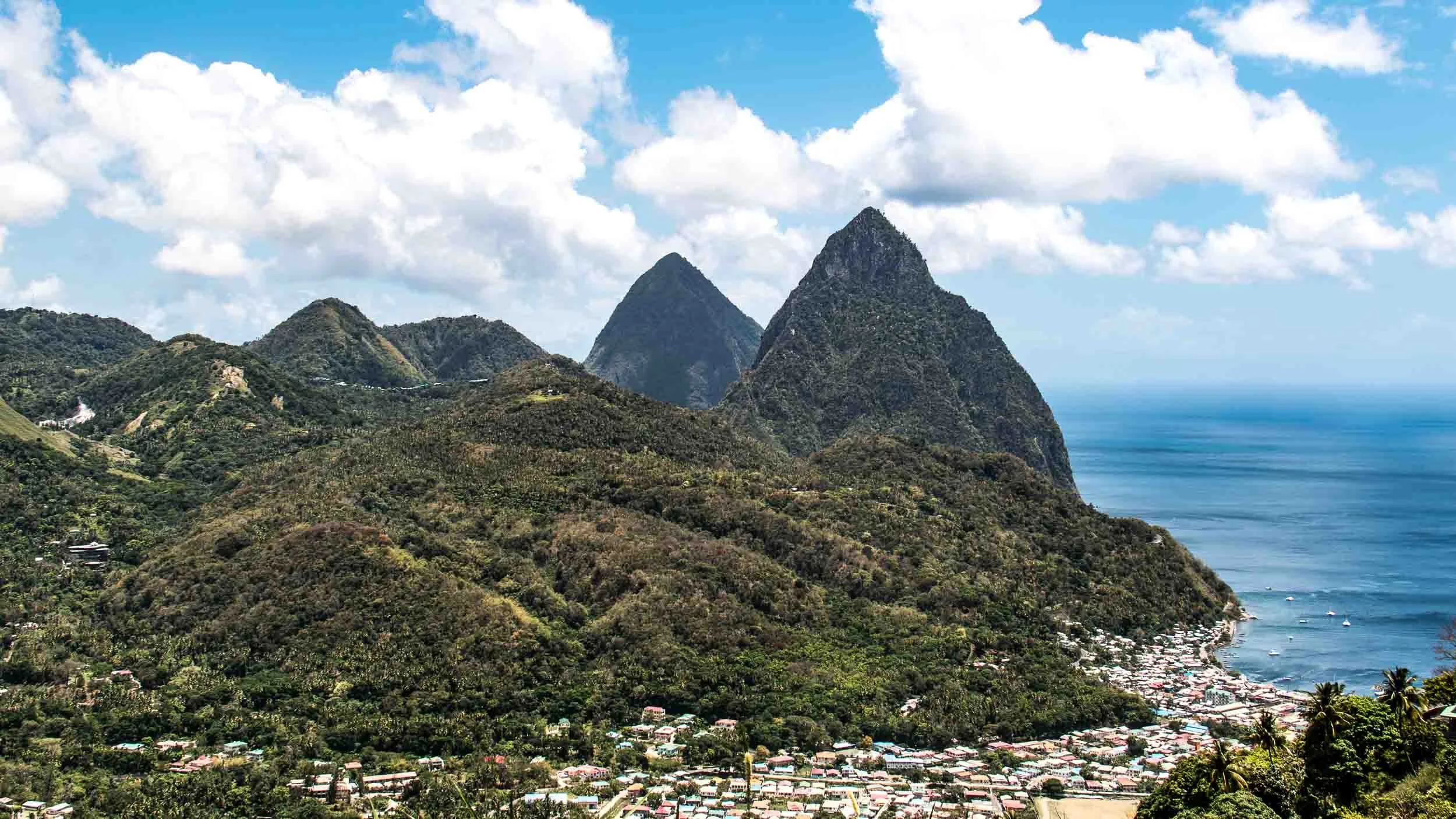 The iconic and world renowned Pitons of St. Lucia. They are Gros Piton and Petite Piton. The town at the base is Soufriere. May 4, 2017.