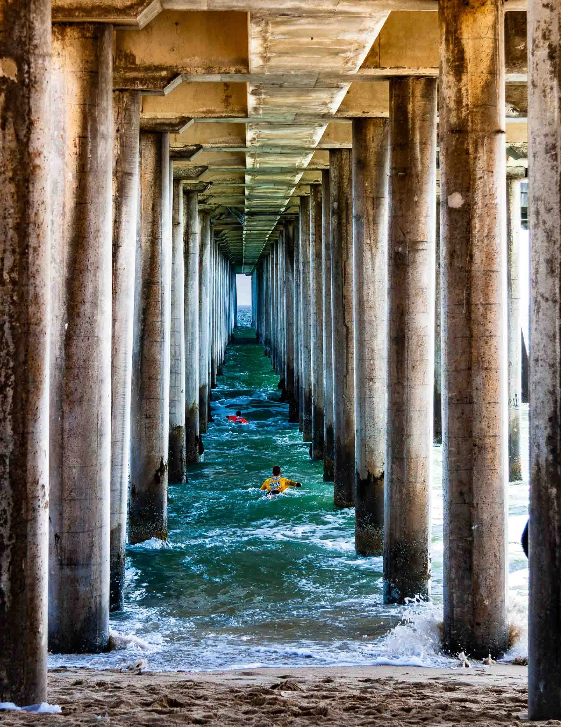 May 14, 2009 - Huntington Beach, California: Swimmers under the Huntington Beach Pier.