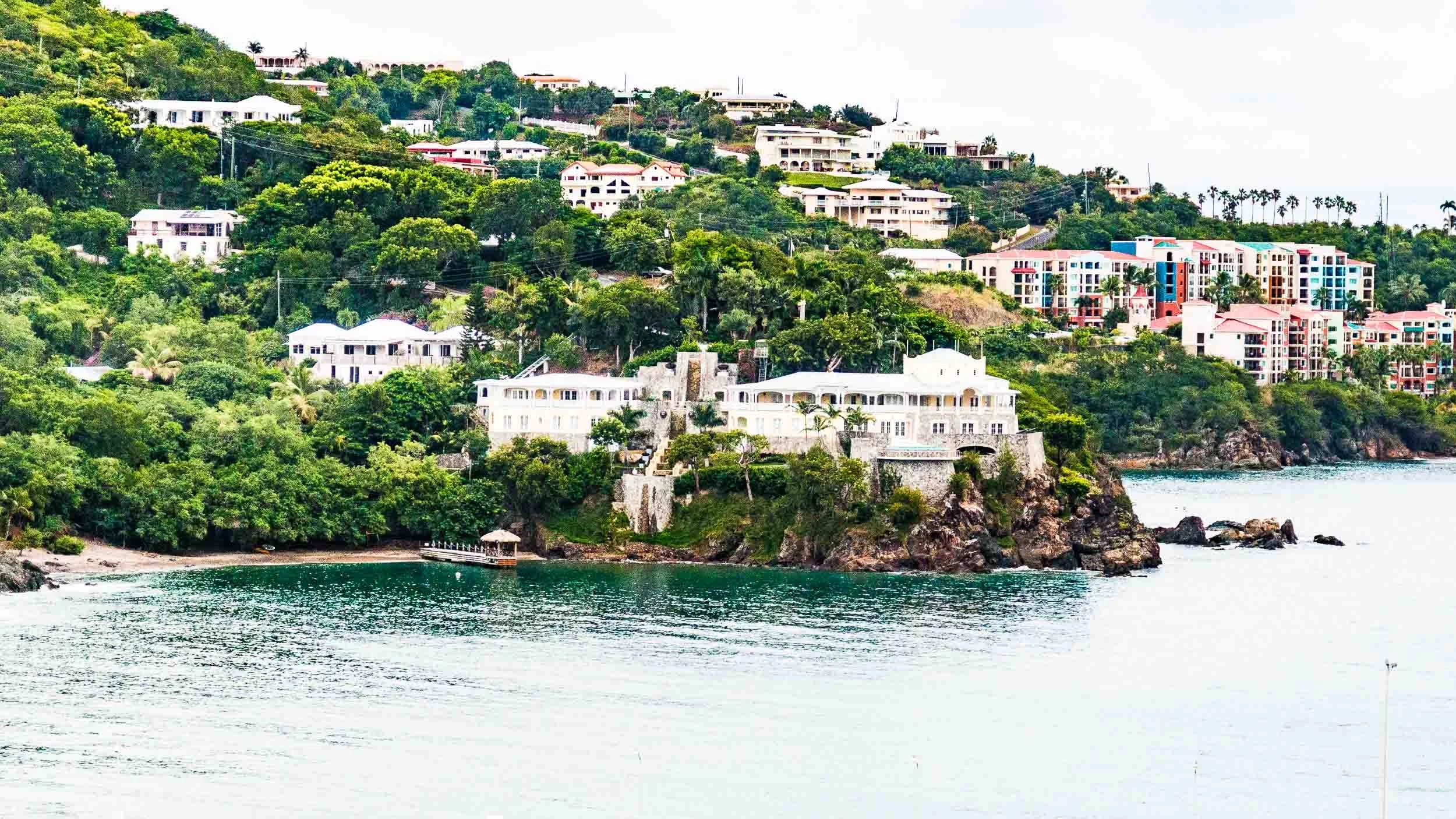 The photo shows a coastal view of Charlotte Amalie in St. Thomas, U.S. Virgin Island (USVI), specifically focusing on the historic and scenic hillside of Government Hill.