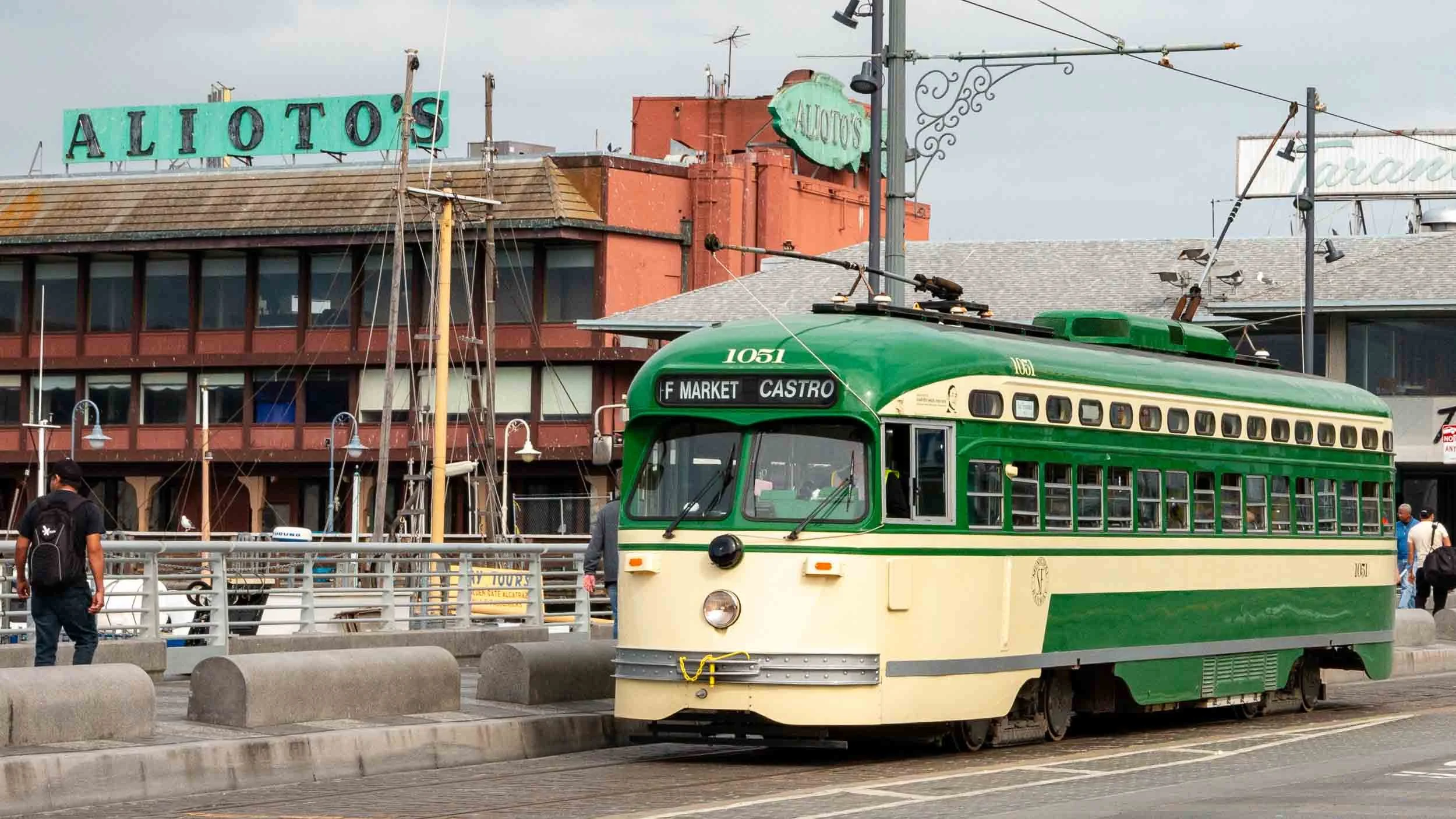 An electric bus that drives on a rail in San Francisco.