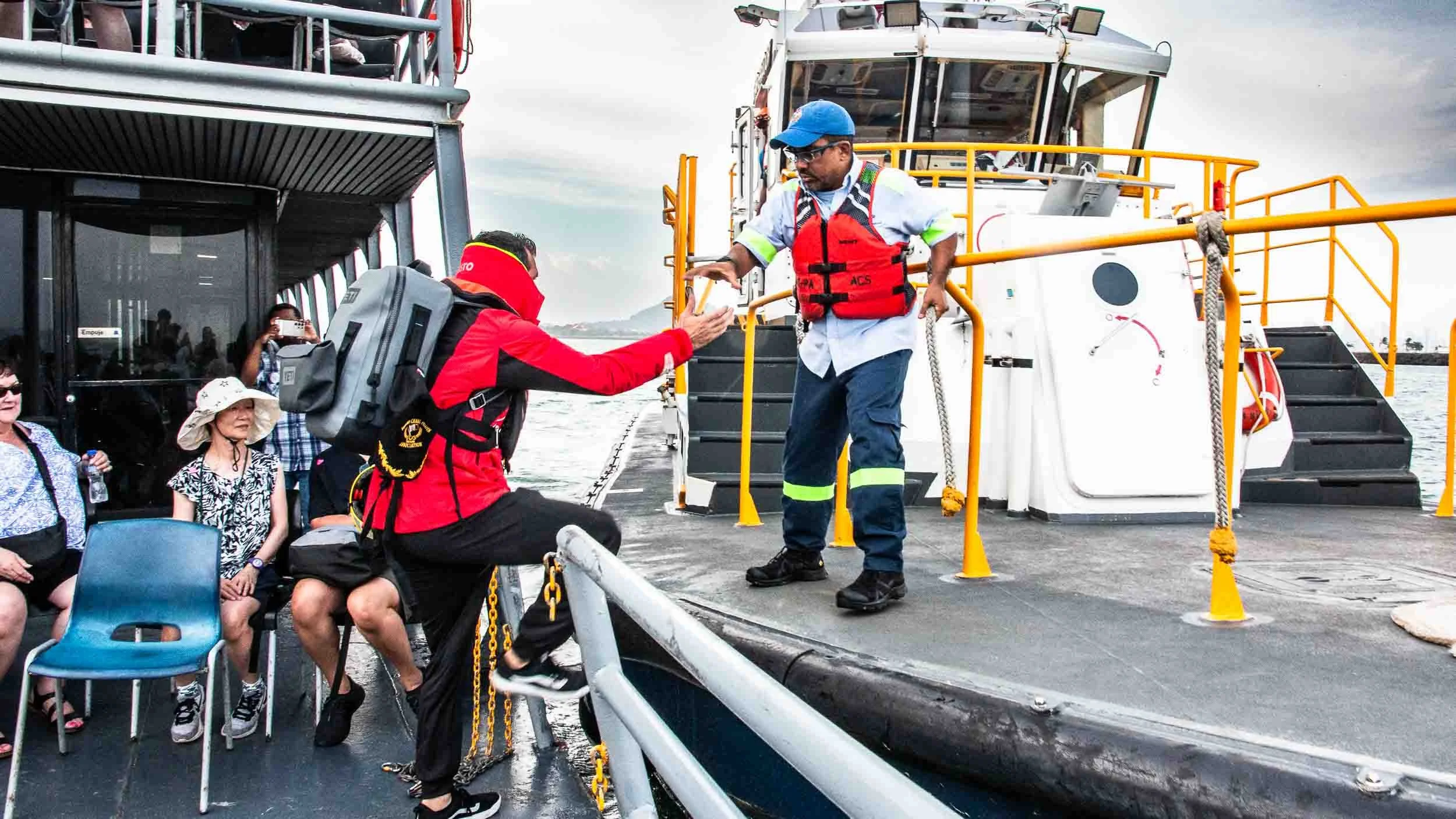 A Canal Pilot operates the boat during the passage through the canal. Here that pilot has completed his task and is now being picked up by one of his colleagues.