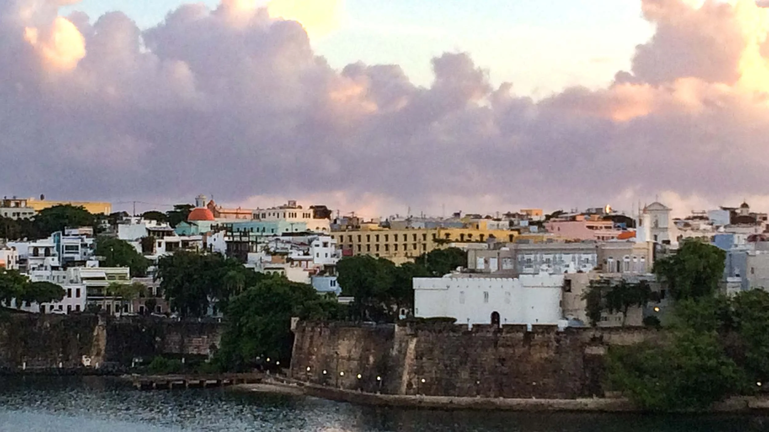 A view of the San Juan Bay and historic city walls at sunrise