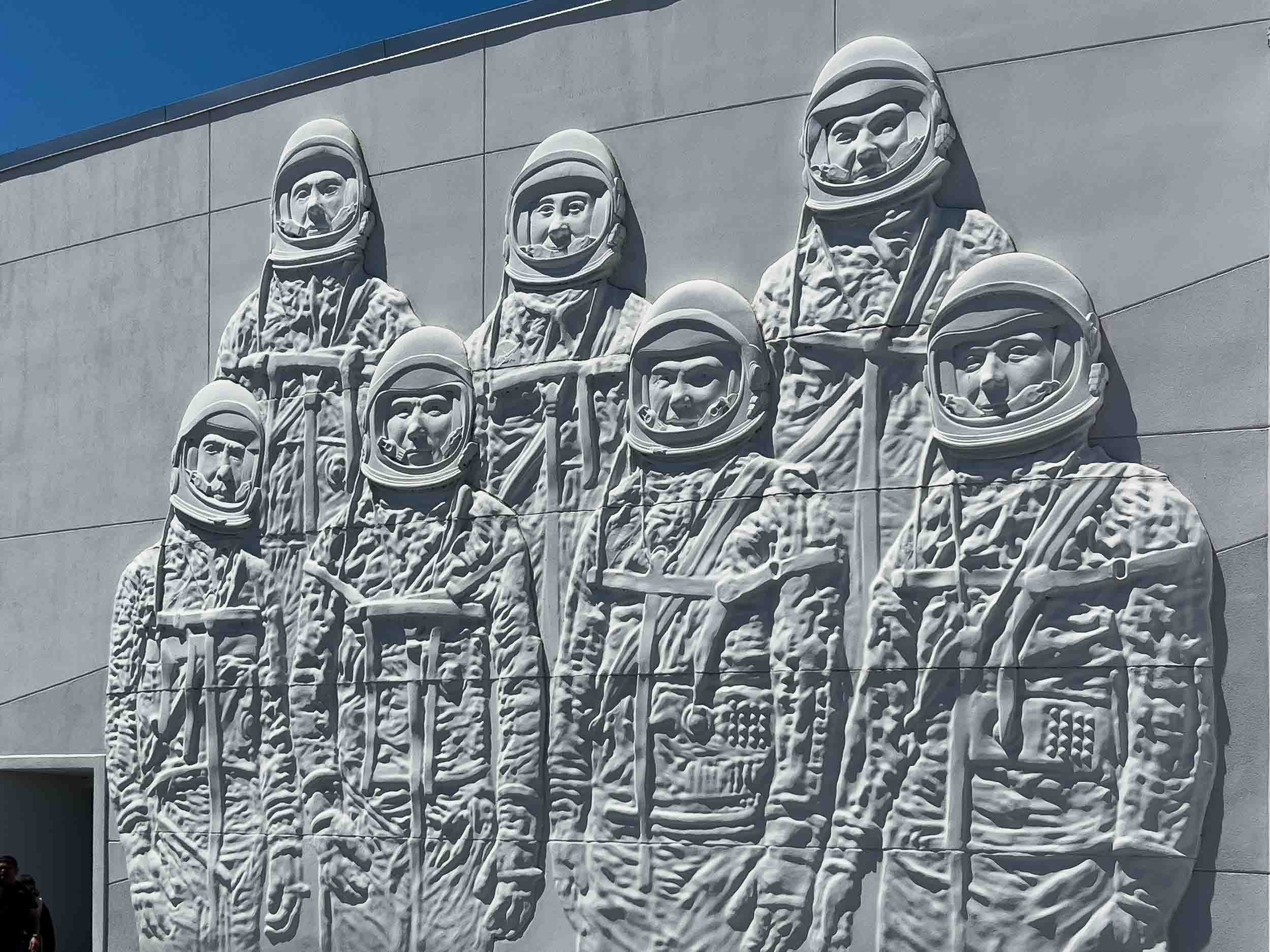 This bas-relief sculpture celebrates America's first space pioneers, the Mercury 7 astronauts: Alan Shepard, John Glen, Gus Crissom, Scott Carpenter, Gordon Cooper, Wally Schirra and Deke Slayton.