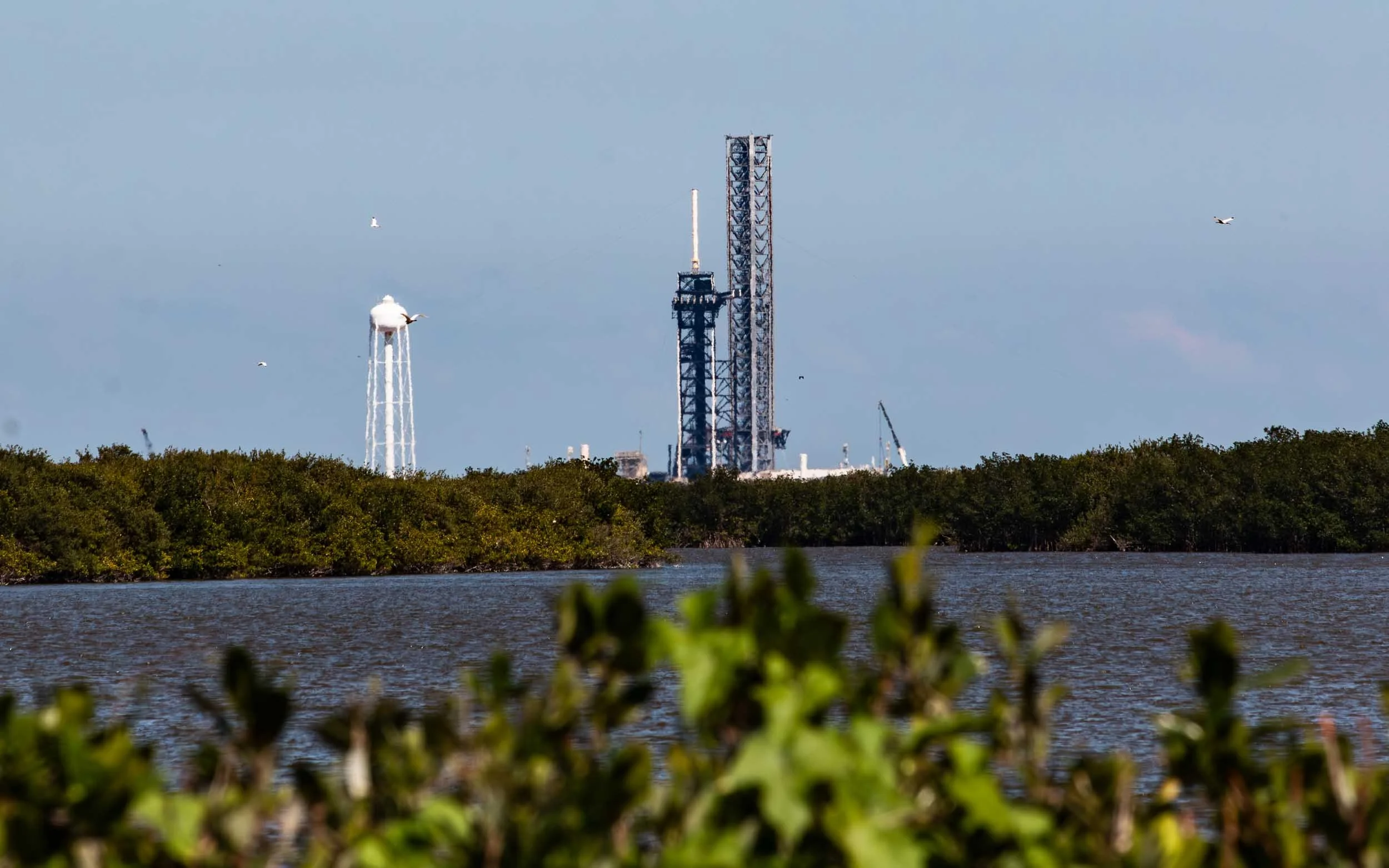 April 13, 2025: Looking at the Space X Falcon 9 rocket prepared for launching at Launch Complex 39A. This photo was taken from the Kennedy Space Center, approximately 6.5 miles south of this launch complex. That rocket was launched very early, just a