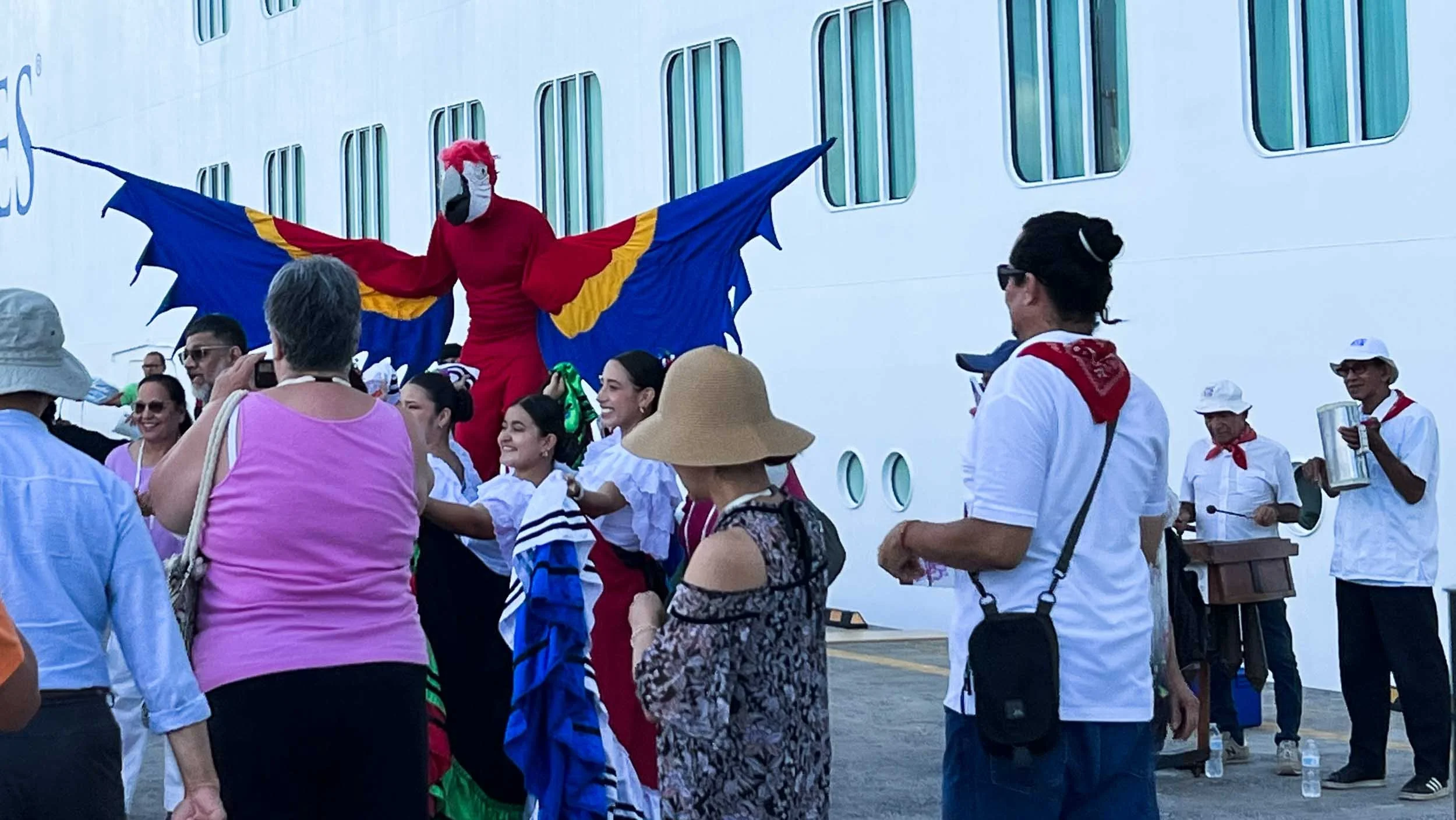 The locals welcome the ship's passengers.