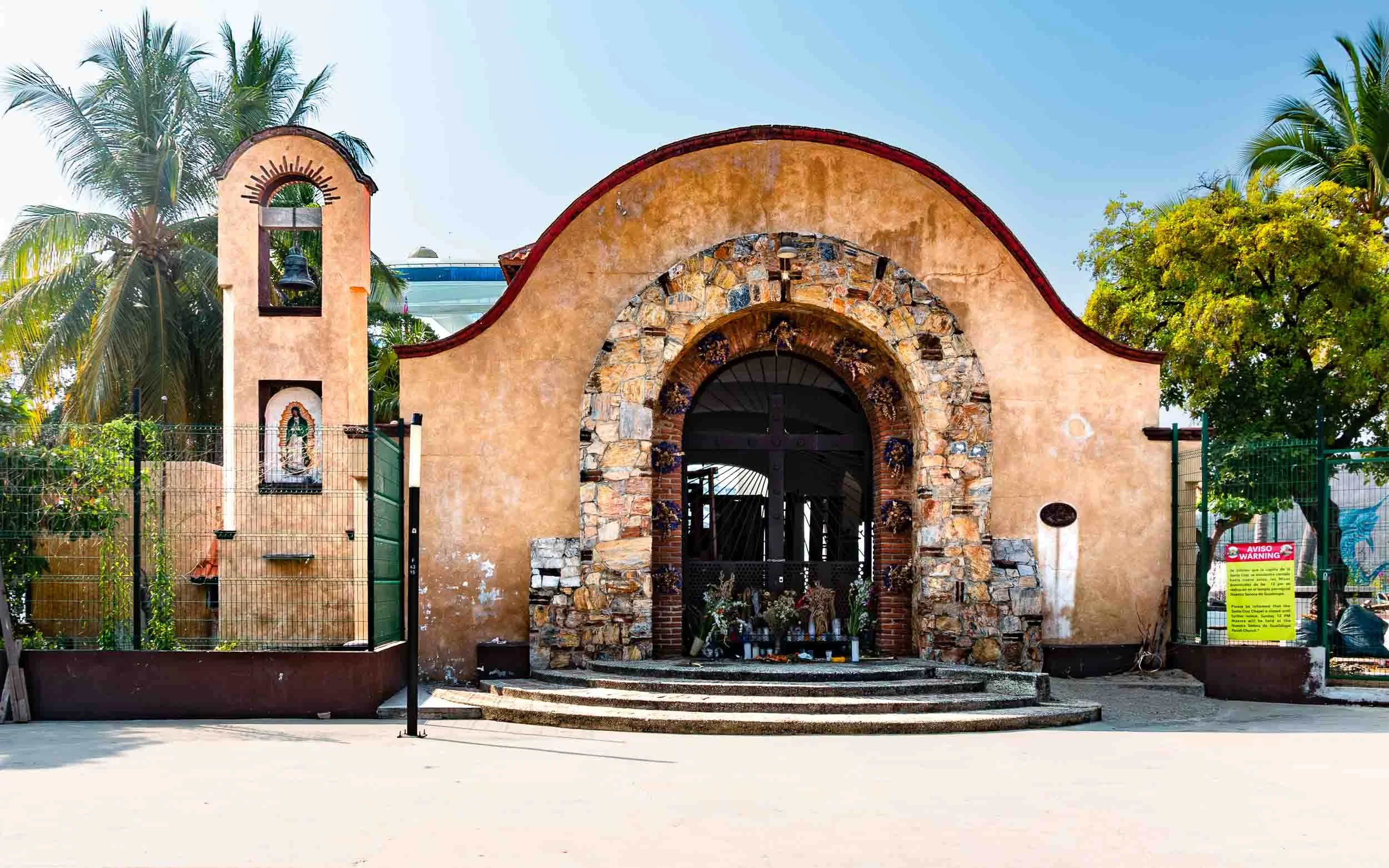 April 25, 2025: Capilla de Santa Cruz (Chapel of the Holy Cross) located on the beachfront of Bahia de Santa Cruz, just steps away from the Huatulco cruise harbor.