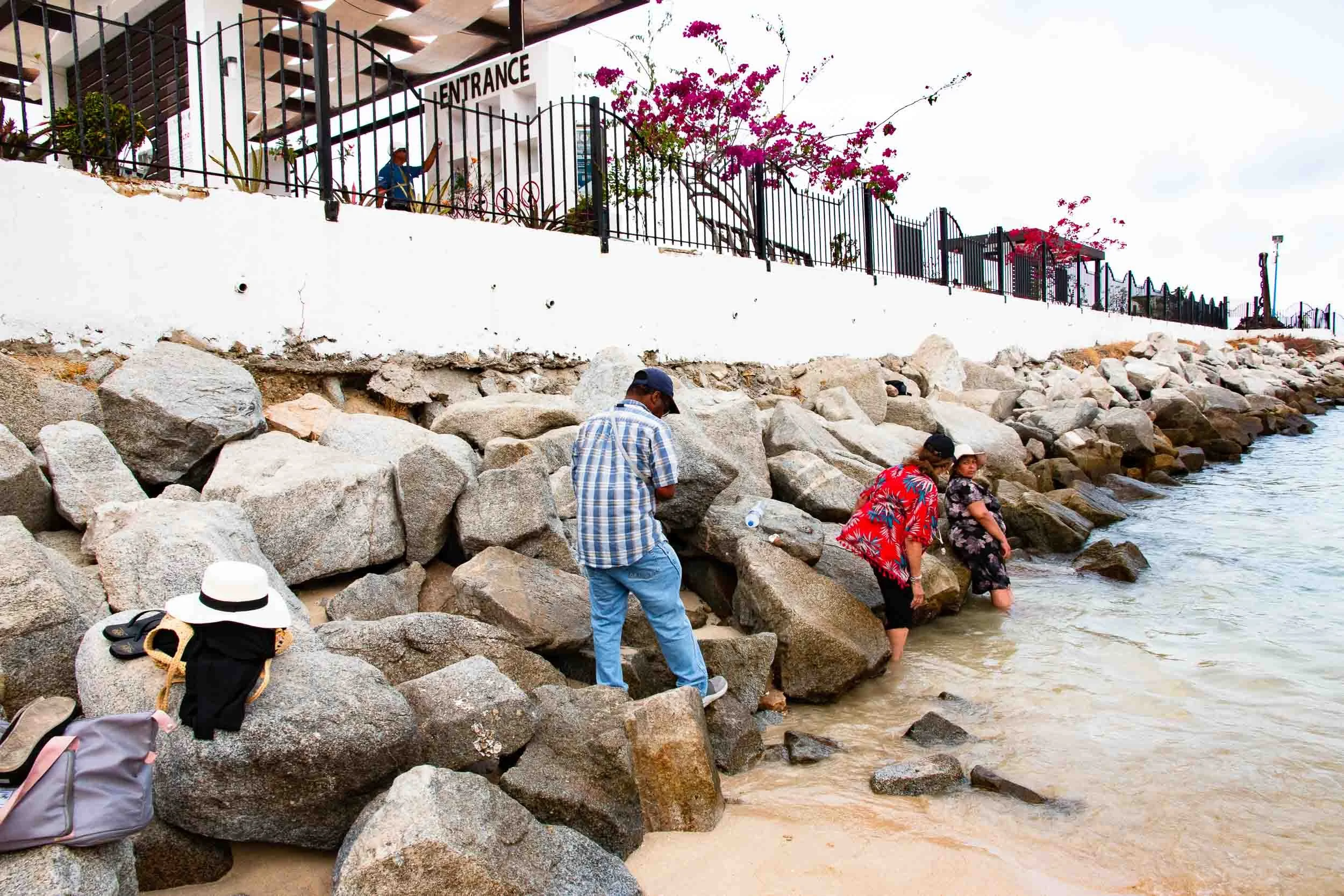Exploring the rocks on the beach in Huatulco.