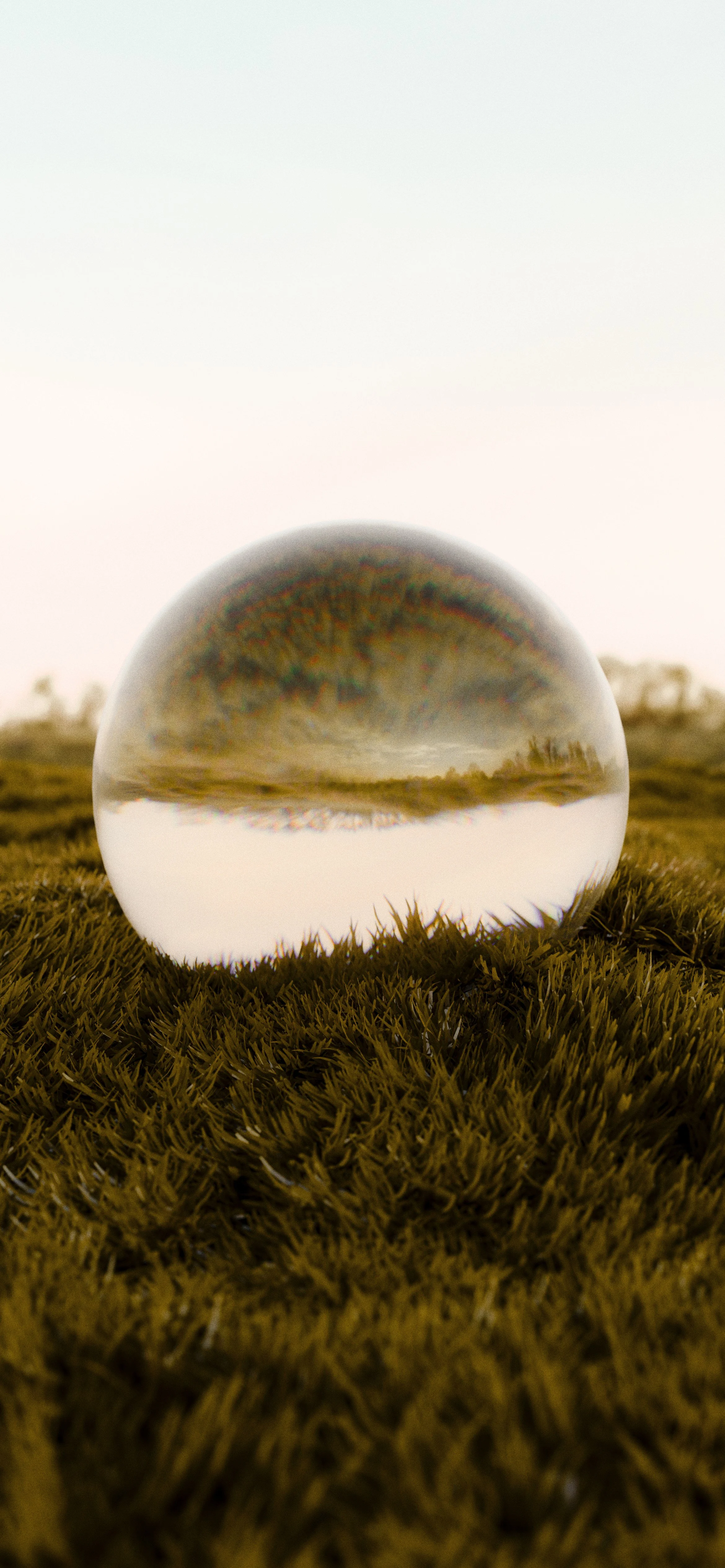 Glass lens reflecting landscape, light and perspective in warm natural tones