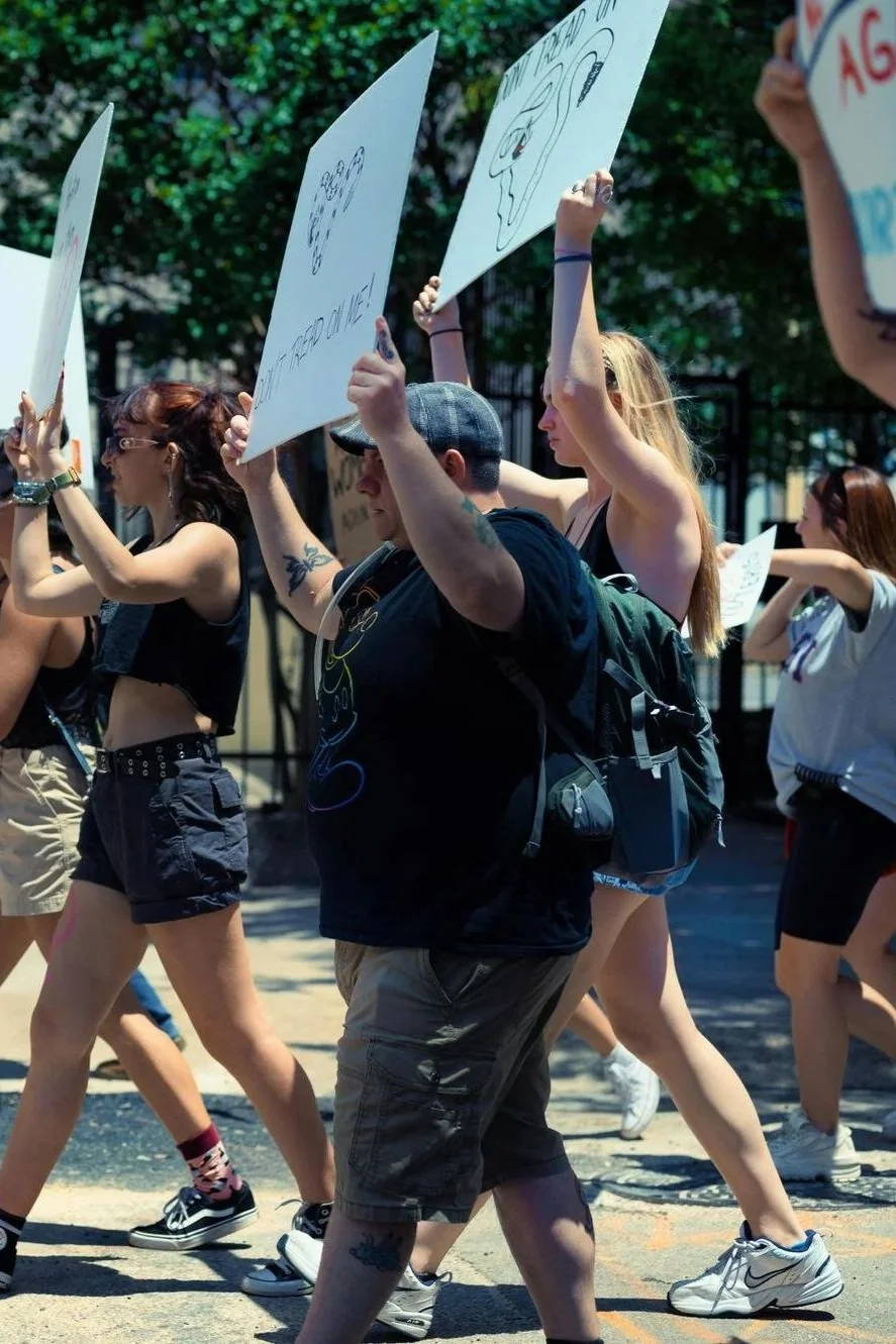 protestors marching with signs