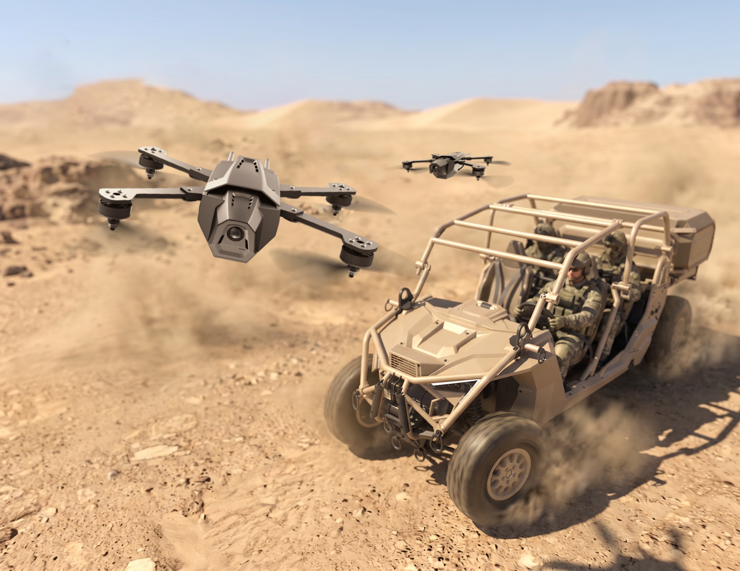 Two Tesseract STRIKER drones flying over a desert landscape with rocky formations in the background, alongside an off-road vehicle with people inside.