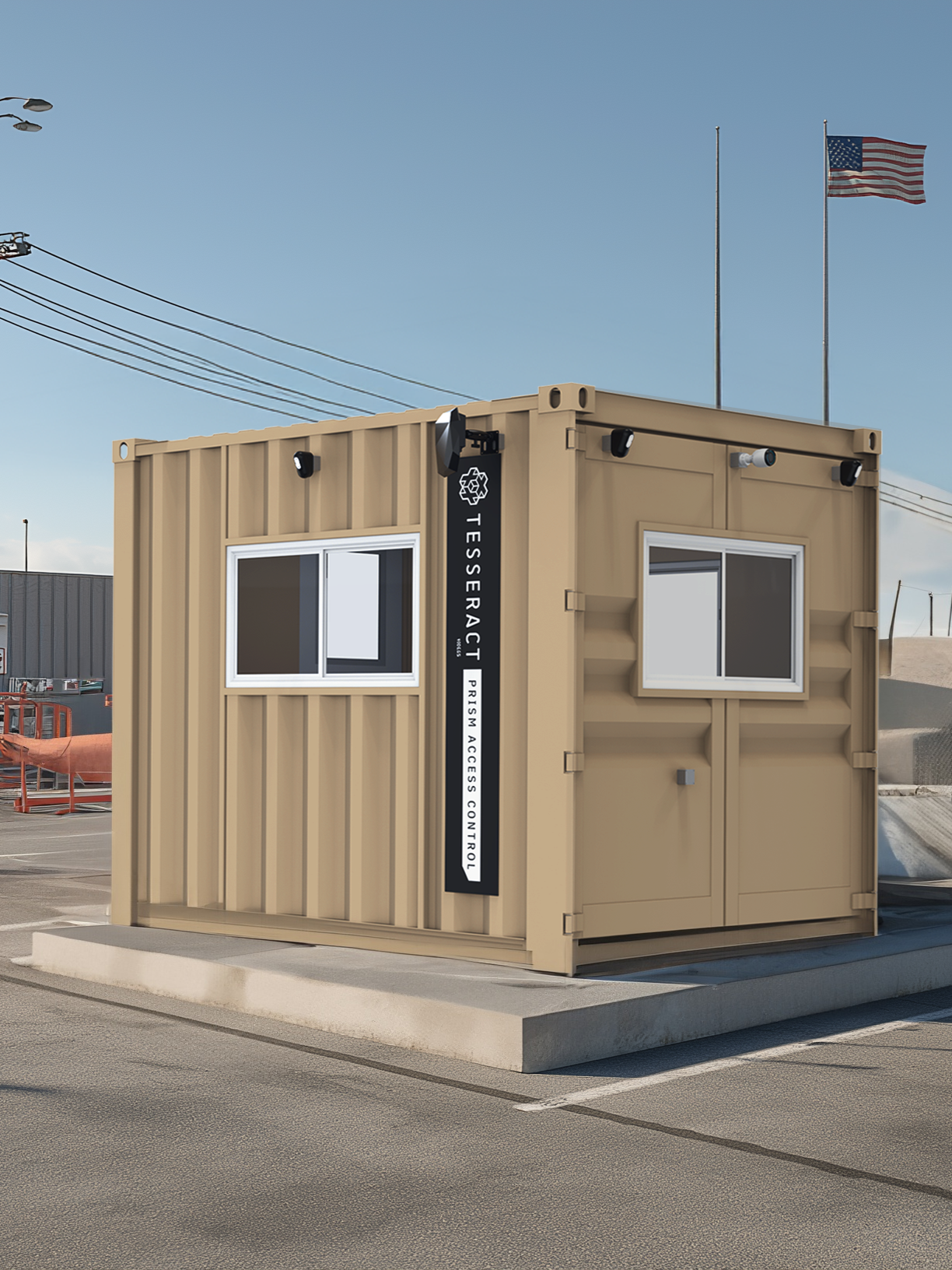 A beige modular container with two white-framed windows, security cameras, and a vertical sign that reads 'TESSERACT Prisma Access Control' located on a parking lot with American flags in the background.