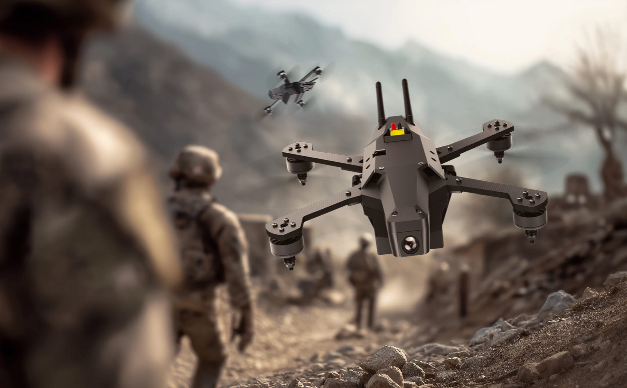 A remote-controlled drone flying in a rocky outdoor environment, with a person observing in the foreground and another drone flying in the background.