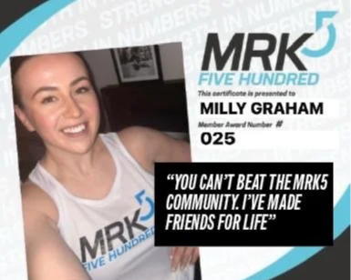 Smiling woman holding a certificate with text, smiling woman wearing MRK5 five hundred T-shirt