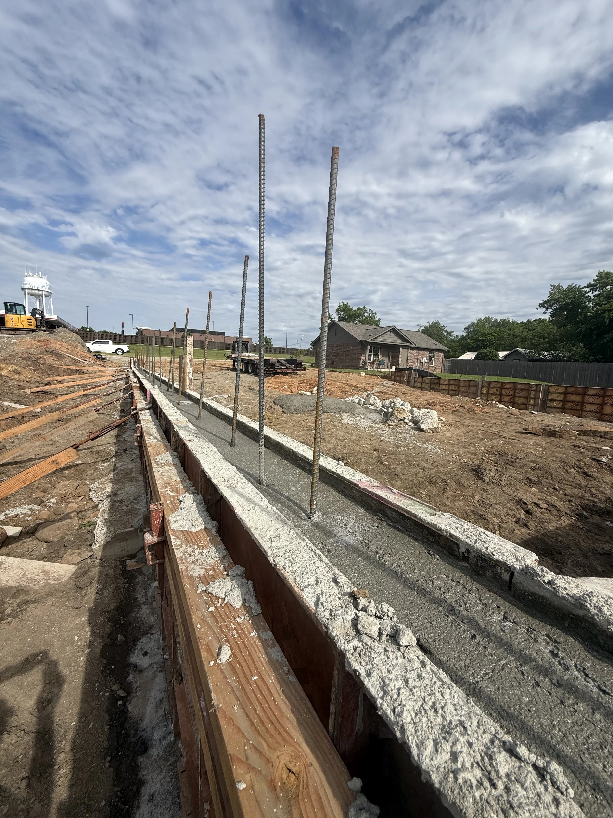 Concrete foundation wall pour with vertical rebar for contractor-ready industrial flex warehouse near Tulsa at the Hwy 97 and I-44 interchange in Sapulpa Oklahoma