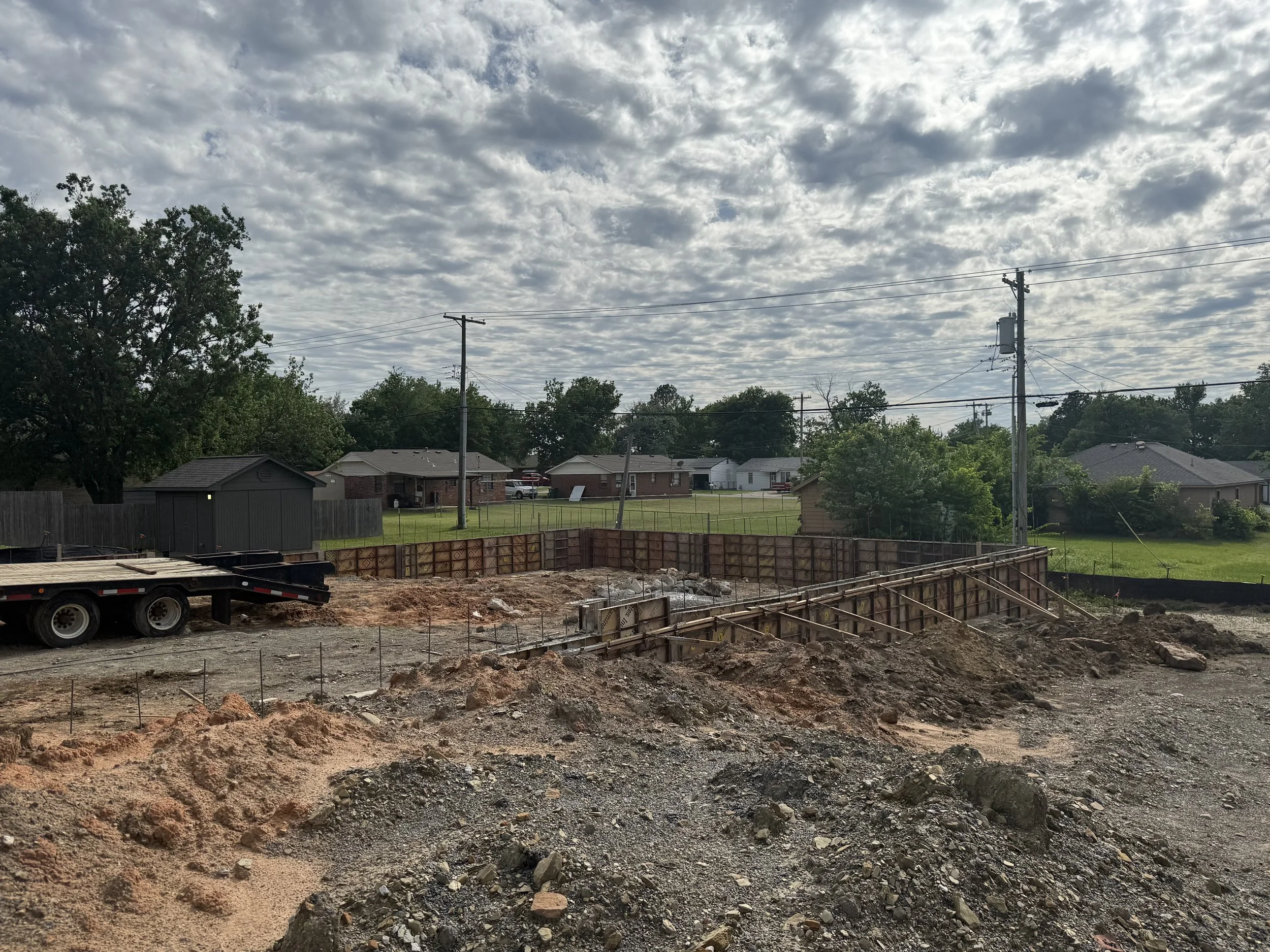 Foundation wall forming and footing excavation for contractor-ready industrial flex warehouse near Tulsa at the Hwy 97 and I-44 interchange in Sapulpa Oklahoma