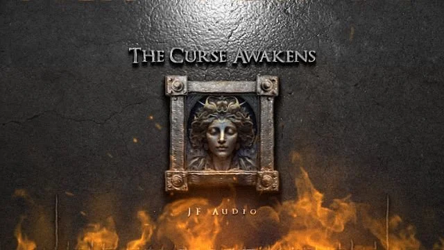 A black wall with a metal sculpture of Medusa's head framed by a square border, the text "The Curse Awakens" above, and "J.J. Audio" below, with flames at the bottom.