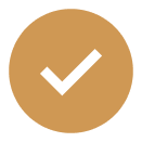 A gold circle with a black check mark in the center.