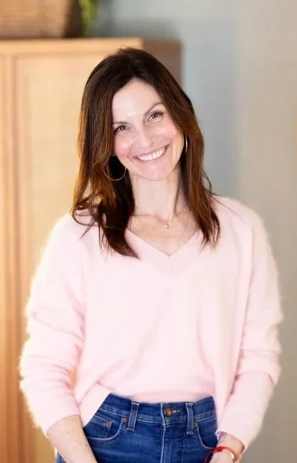 Rebecca Tofield, therapist, smiling in the waiting area of her Scottsdale office.