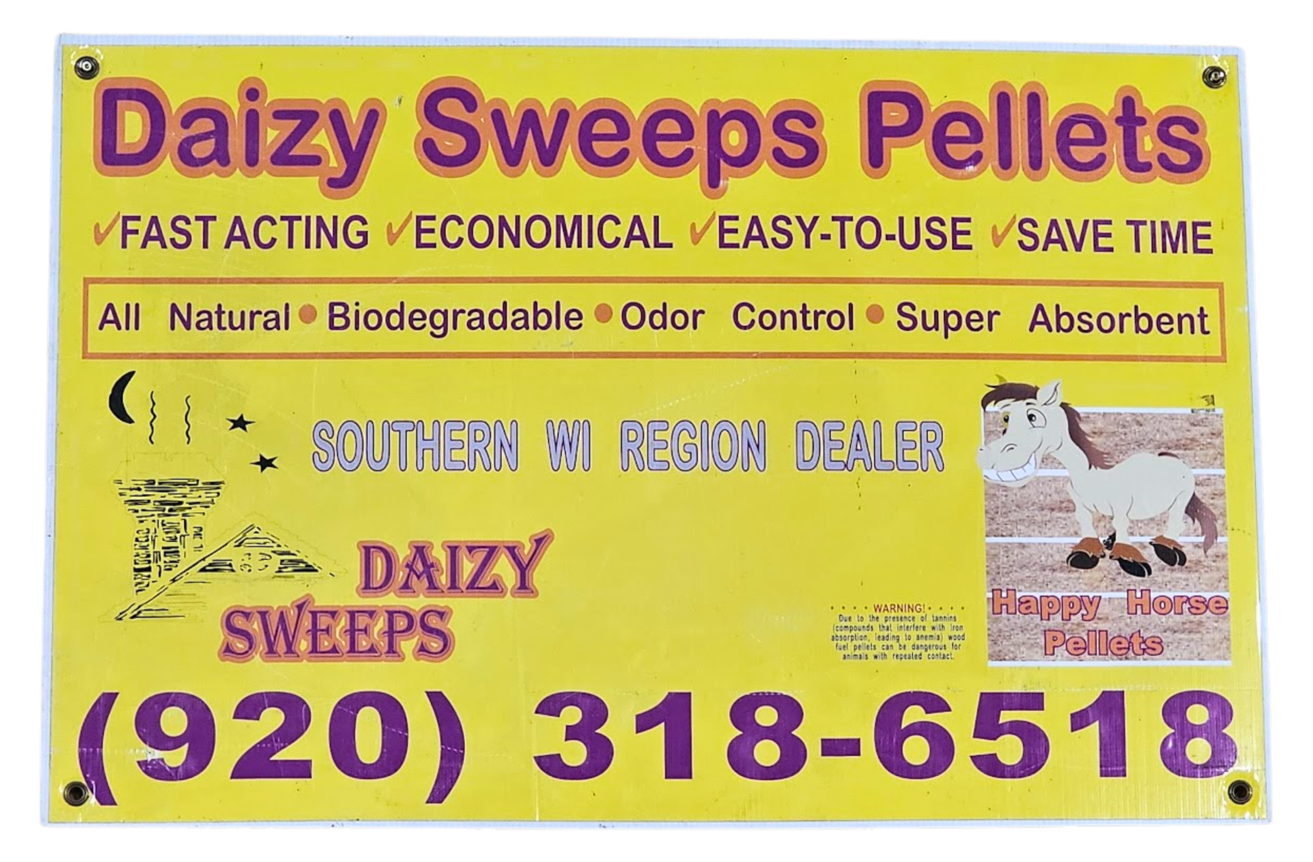 Yellow advertisement sign for Daizy Sweeps Pellets with purple and orange text promoting fast acting, economical, easy-to-use, time-saving, all natural, biodegradable, odor control, super absorbent horse pellets. The sign features a drawing of a pyramid with a crescent moon, stars, and a cloud of steam. There is also an illustration of a smiling cartoon horse on the right side with text that reads "Happy Horse Pellets." A small warning note is visible near the bottom.