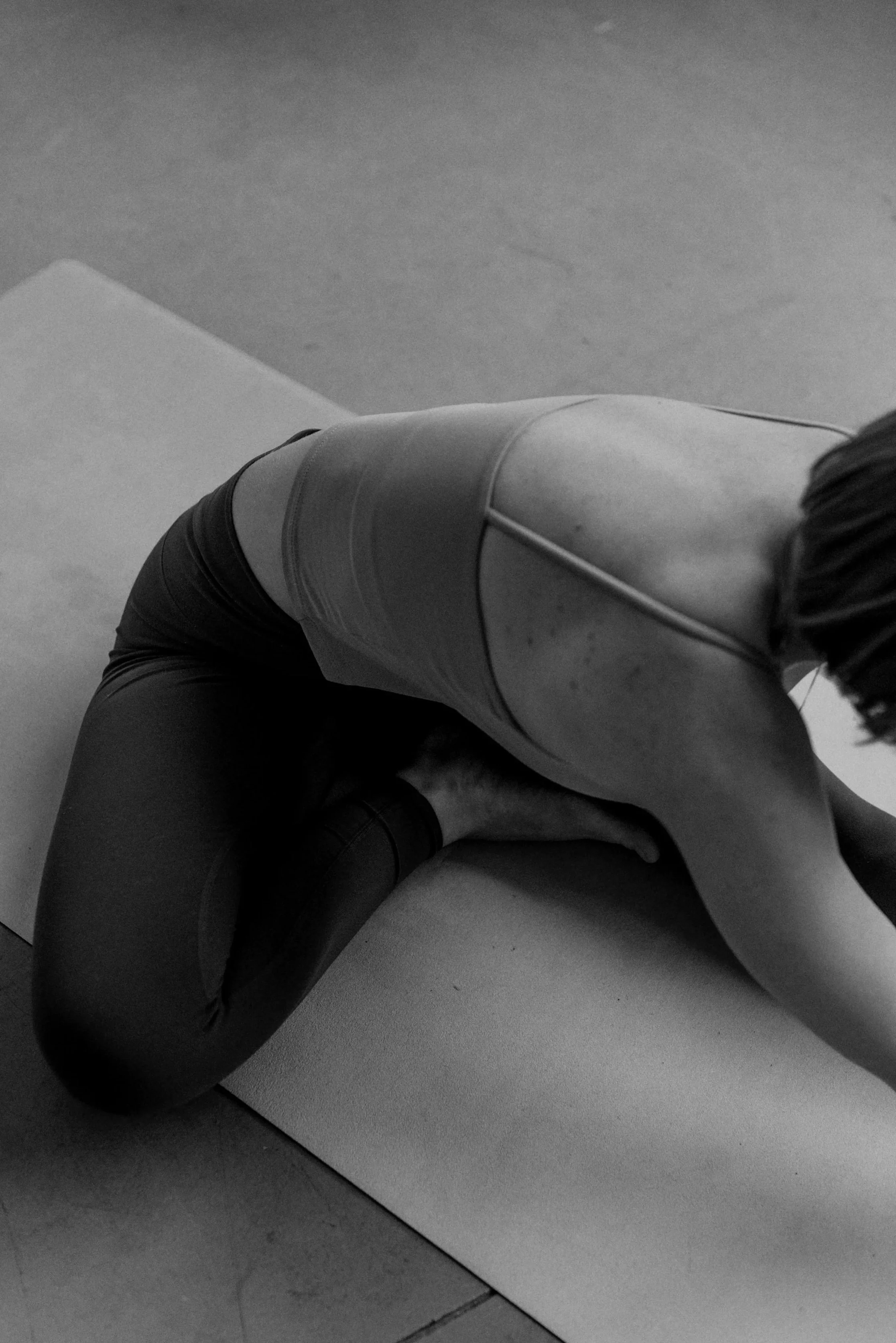 Person practising yoga on a mat during the Iceland Yoga Adventure.